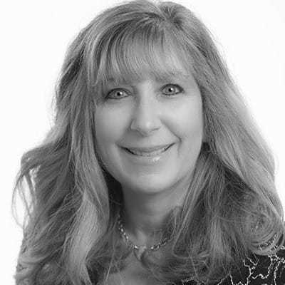 Portrait of Melissa Eppinger, a professional stylist at The Robert Andrew Salon & Spa Collection, showcasing their expertise and style.