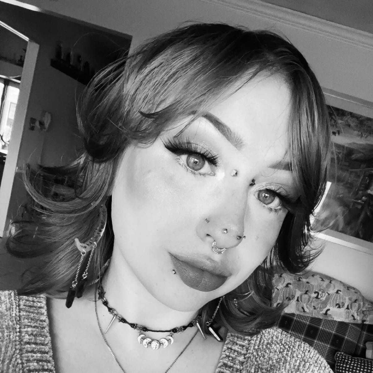 Portrait of Julia, a professional stylist at The Robert Andrew Salon & Spa Collection, showcasing their expertise and style.