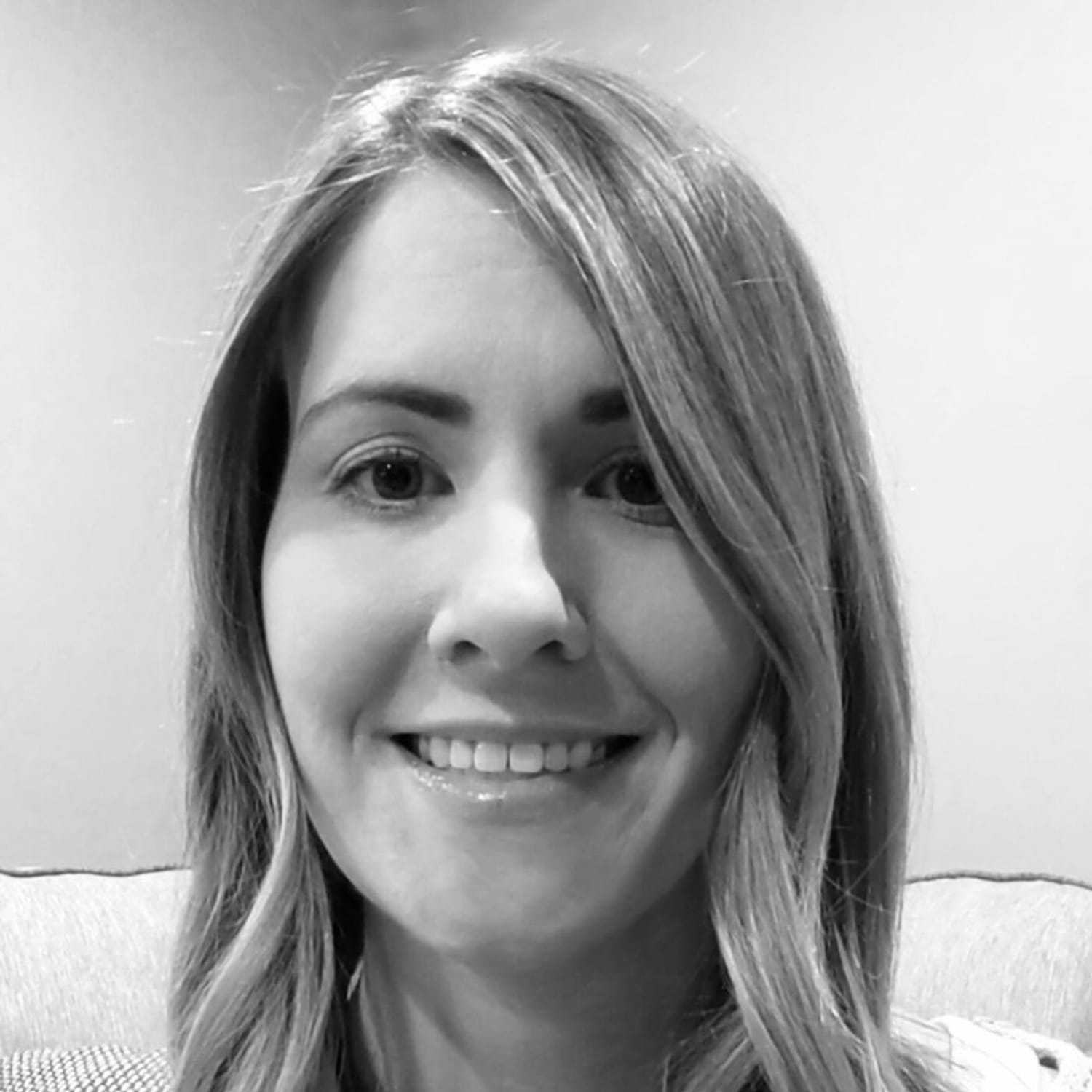 Portrait of Kara, a professional stylist at The Robert Andrew Salon & Spa Collection, showcasing their expertise and style.