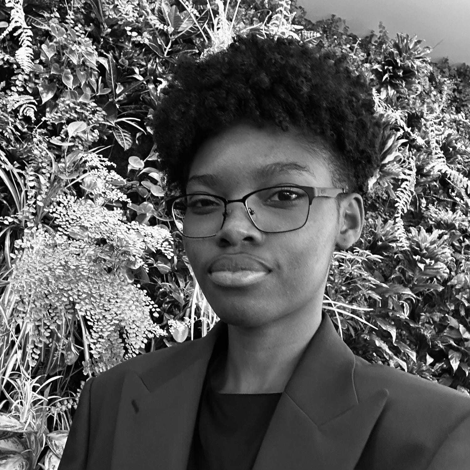 Portrait of Micayhla, a professional stylist at The Robert Andrew Salon & Spa Collection, showcasing their expertise and style.