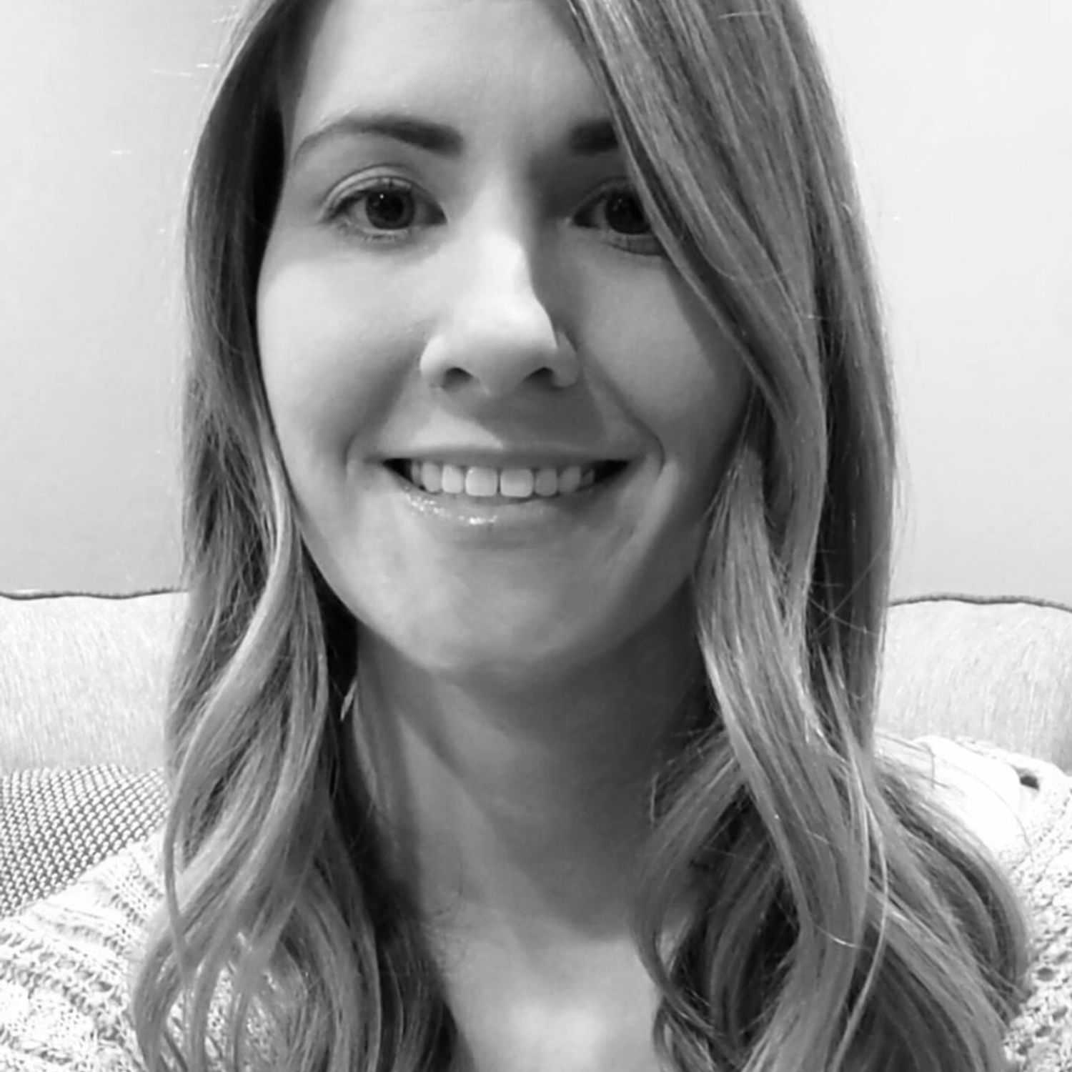 Portrait of Kara, a professional stylist at The Robert Andrew Salon & Spa Collection, showcasing their expertise and style.