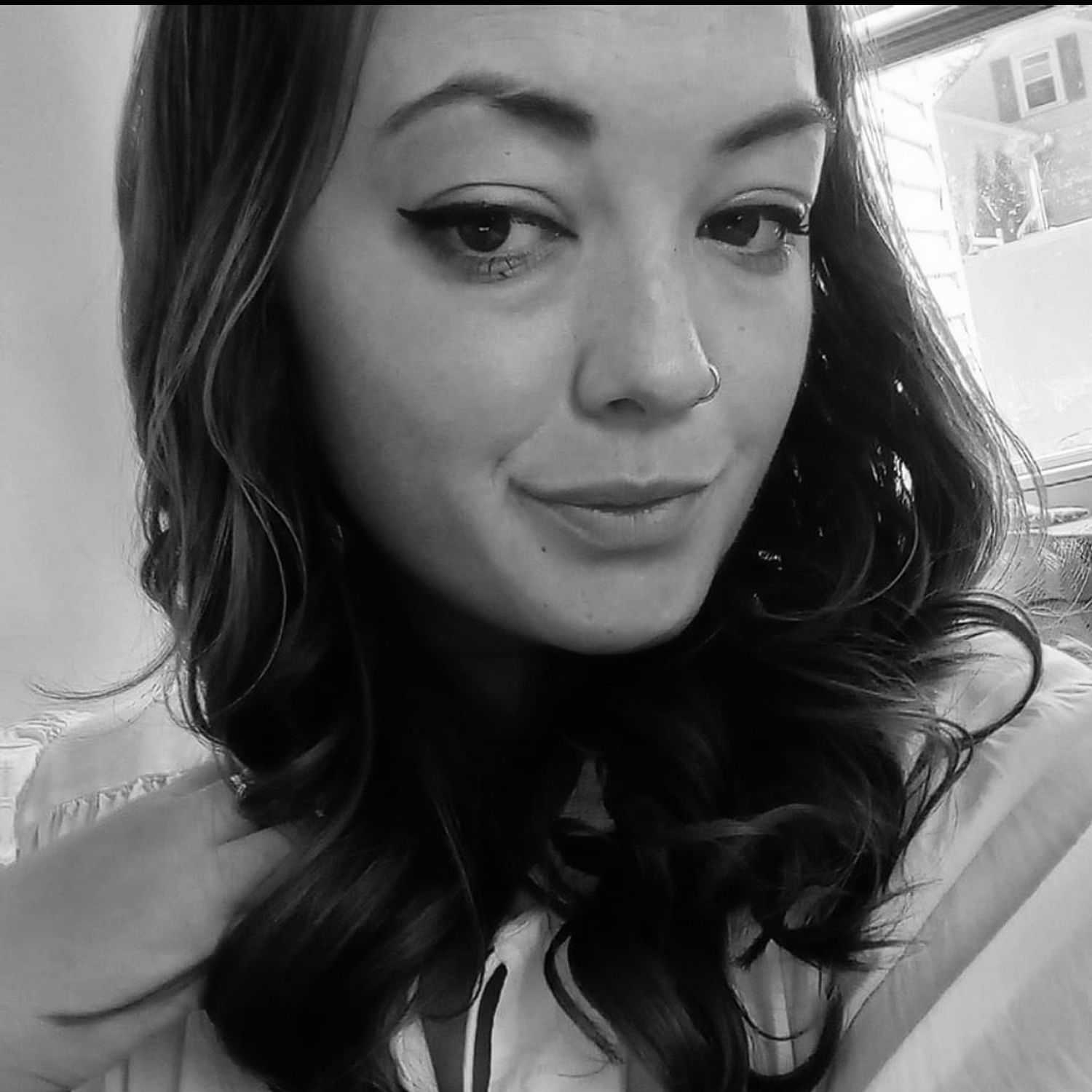 Portrait of Amy M., a professional stylist at The Robert Andrew Salon & Spa Collection, showcasing their expertise and style.