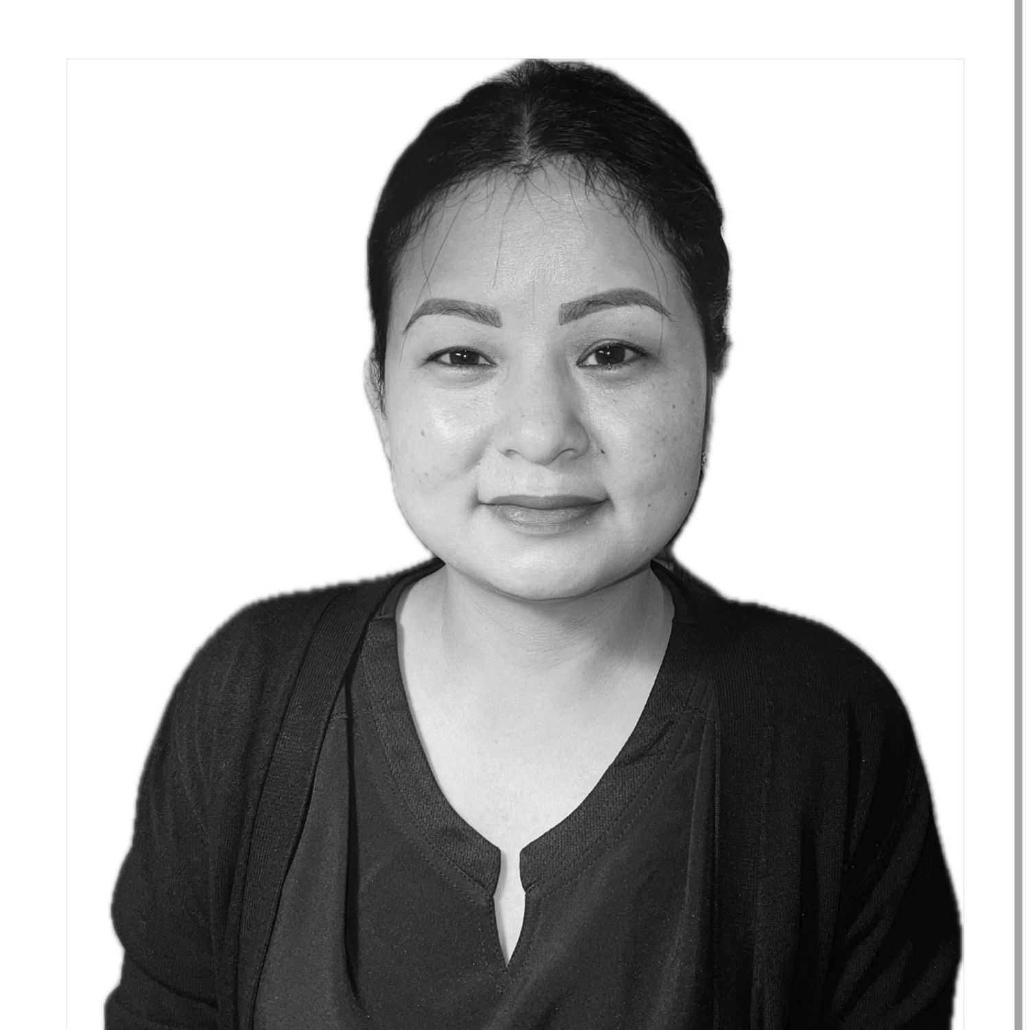 Portrait of Ganga, a professional stylist at The Robert Andrew Salon & Spa Collection, showcasing their expertise and style.