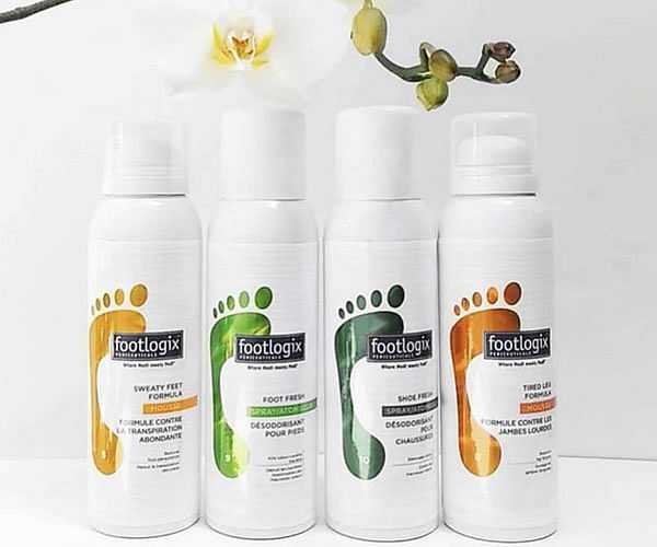 Four Footlogix foot care products lined up with an orchid on top.