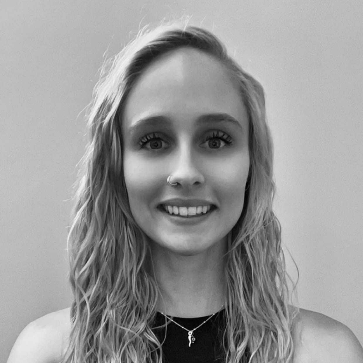 Portrait of Grace Lukowski, a professional stylist at The Robert Andrew Salon & Spa Collection, showcasing their expertise and style.