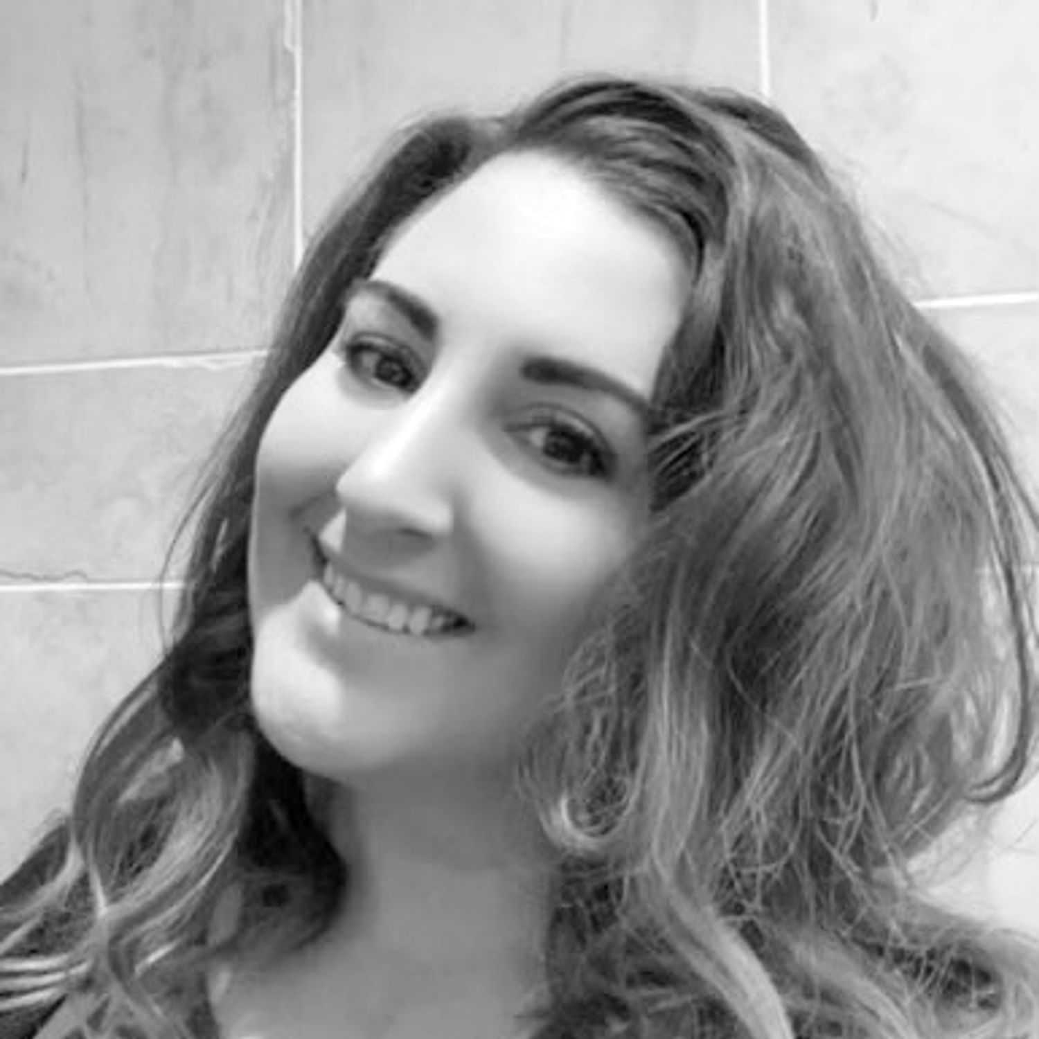 Portrait of Sarah Beck, a professional stylist at The Robert Andrew Salon & Spa Collection, showcasing their expertise and style.