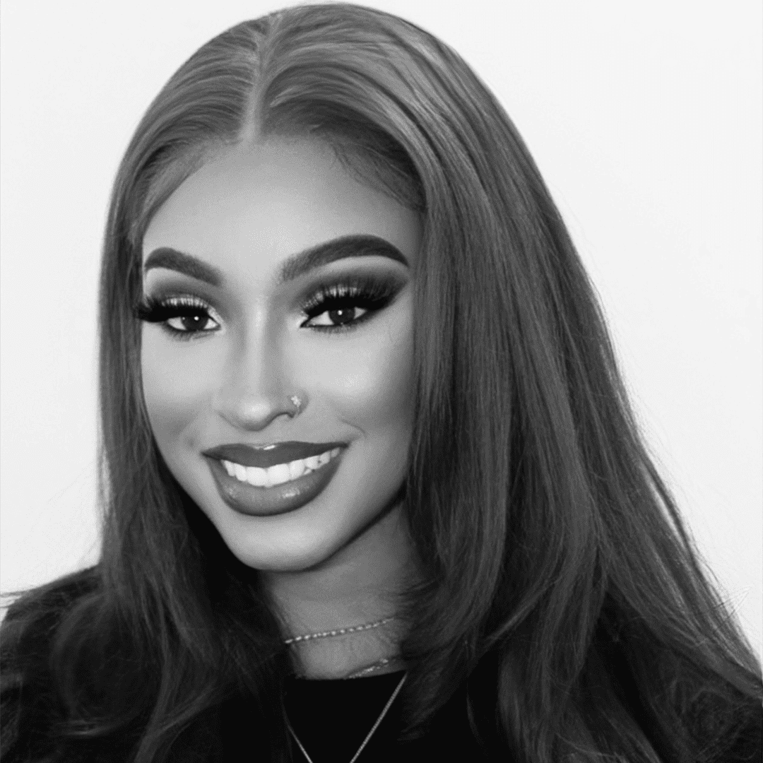 Portrait of Nyla, a professional stylist at The Robert Andrew Salon & Spa Collection, showcasing their expertise and style.