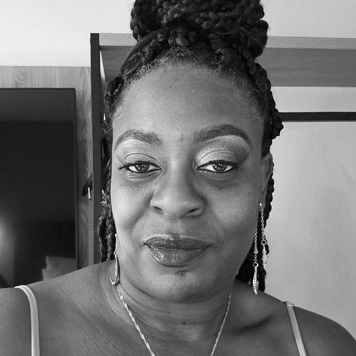 Portrait of Crystal, a professional stylist at The Robert Andrew Salon & Spa Collection, showcasing their expertise and style.