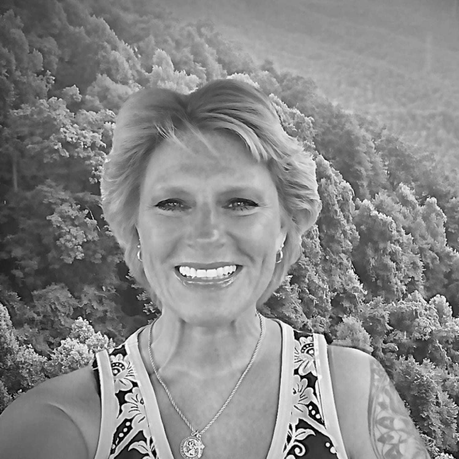 Portrait of Colleen, a professional stylist at The Robert Andrew Salon & Spa Collection, showcasing their expertise and style.