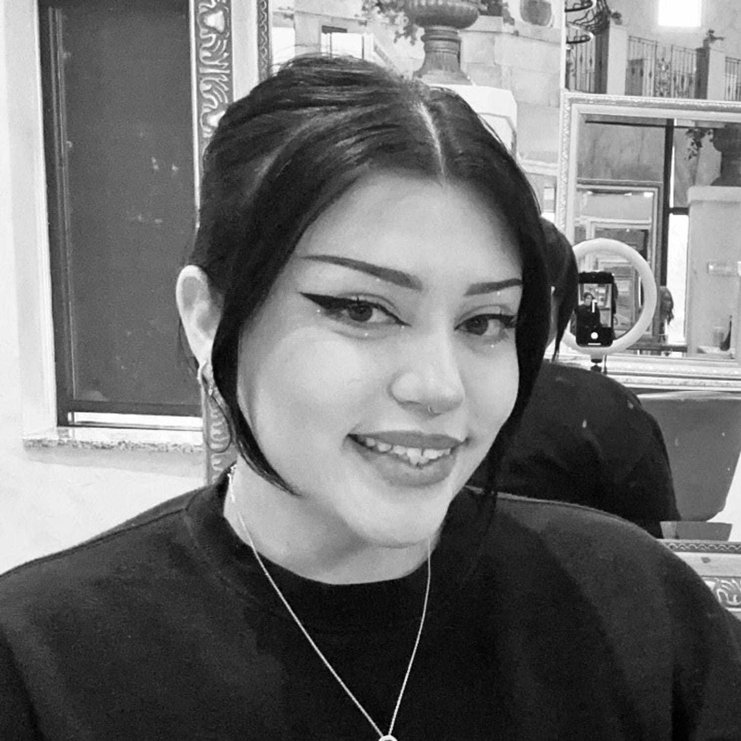 Portrait of Victoria, a professional stylist at The Robert Andrew Salon & Spa Collection, showcasing their expertise and style.