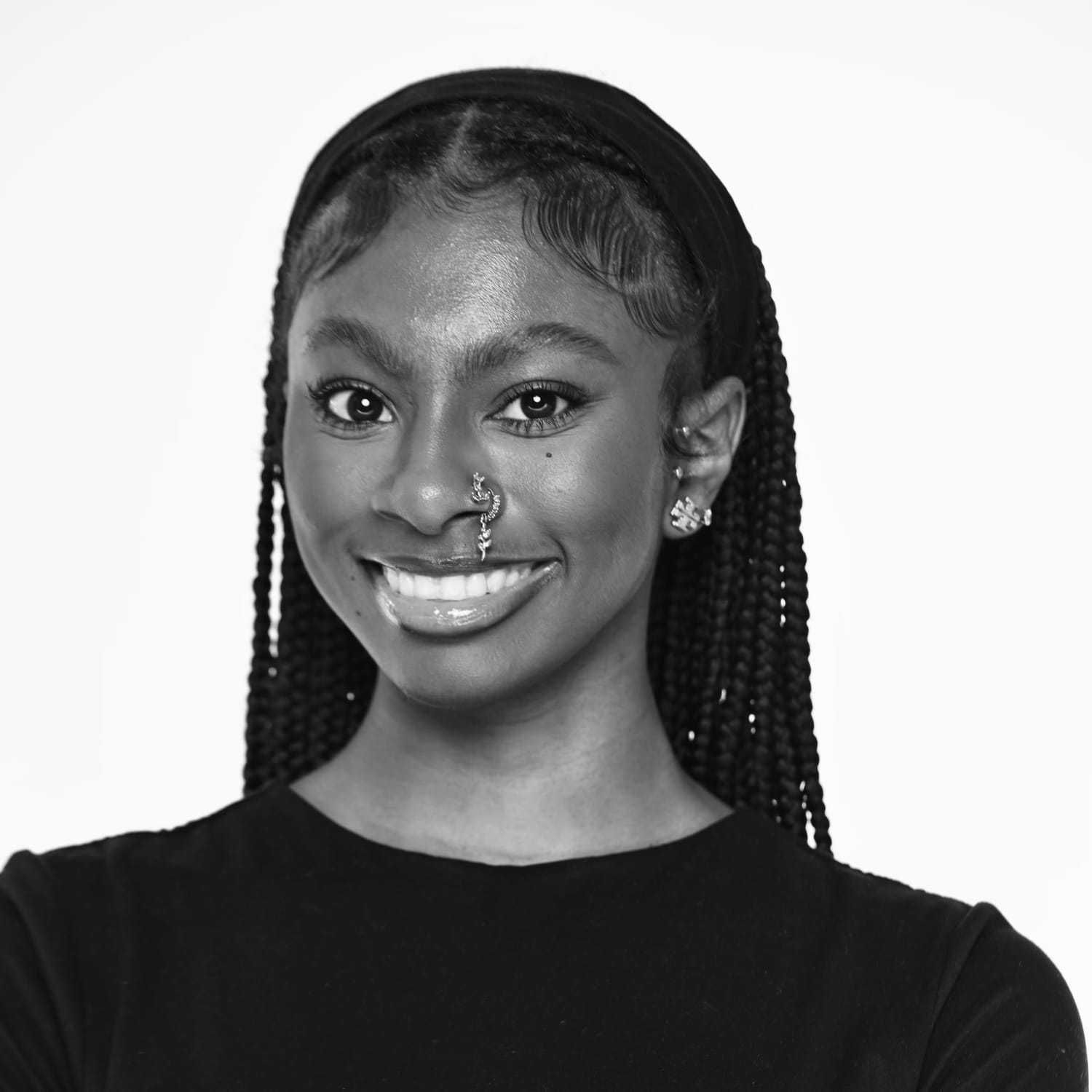 Portrait of Koryne, a professional stylist at The Robert Andrew Salon & Spa Collection, showcasing their expertise and style.