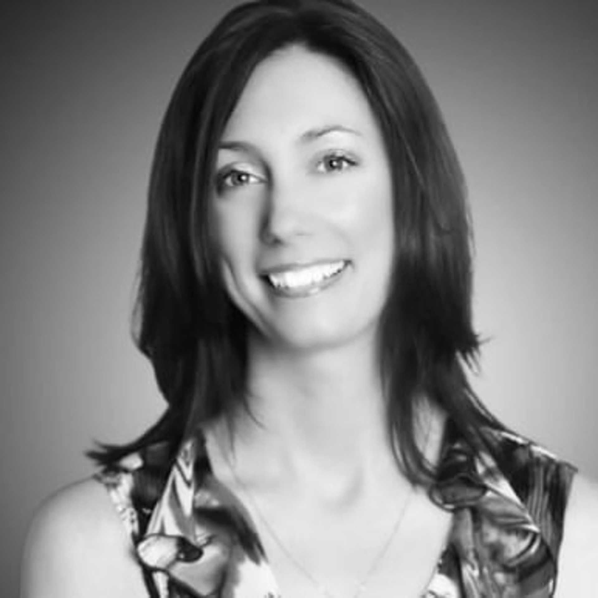 Portrait of Amanda, a professional stylist at The Robert Andrew Salon & Spa Collection, showcasing their expertise and style.