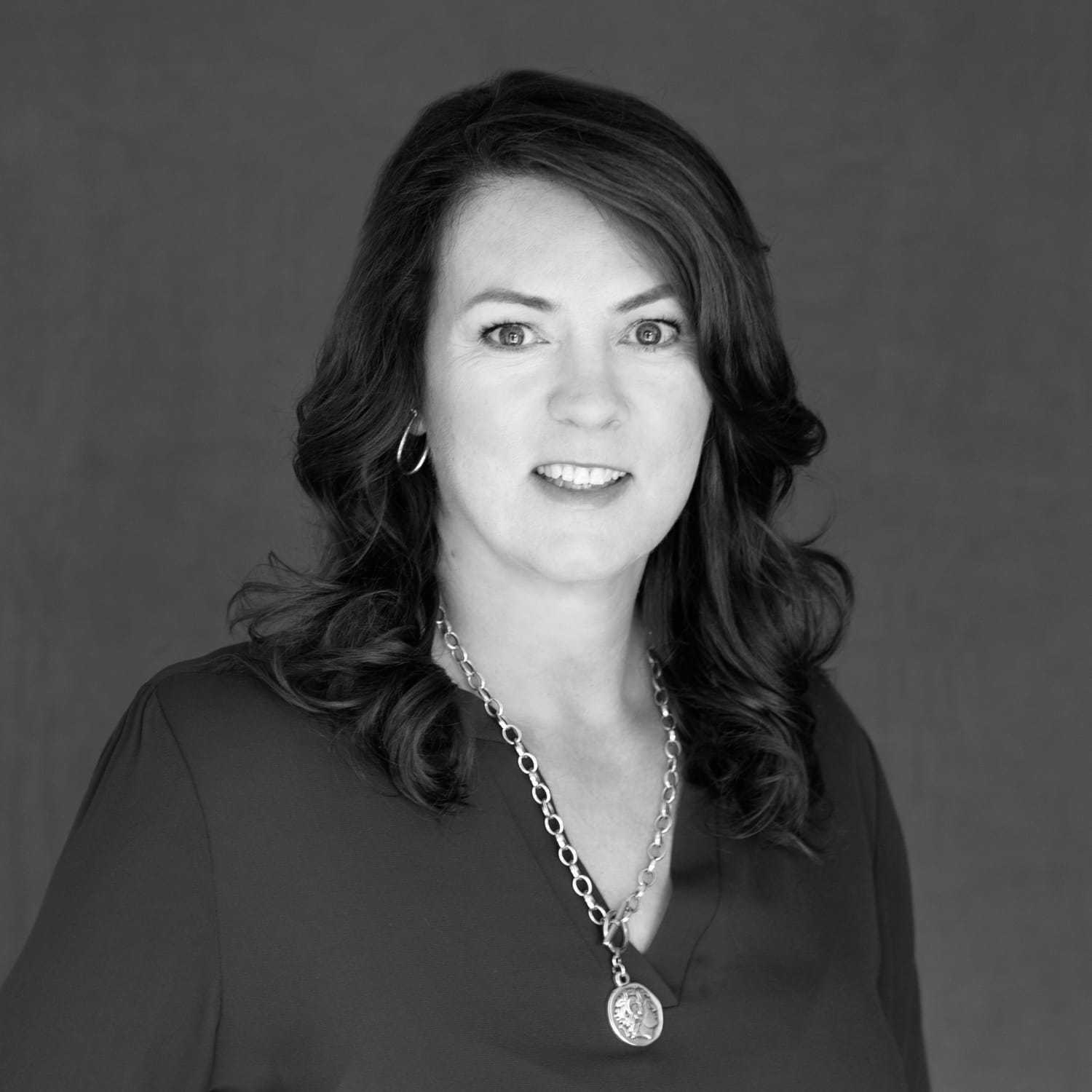 Portrait of Mary, a professional stylist at The Robert Andrew Salon & Spa Collection, showcasing their expertise and style.