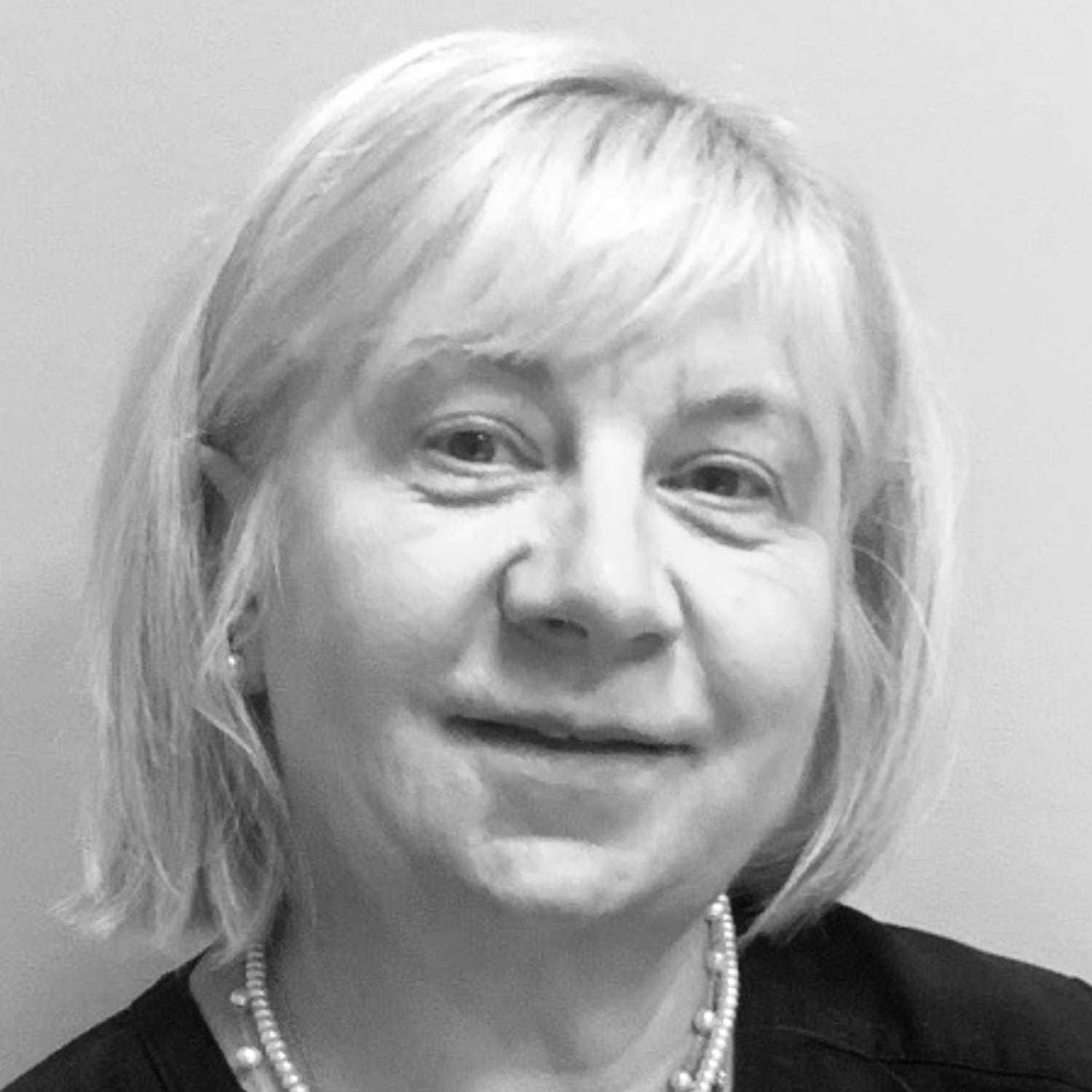 Portrait of Nina, a professional stylist at The Robert Andrew Salon & Spa Collection, showcasing their expertise and style.