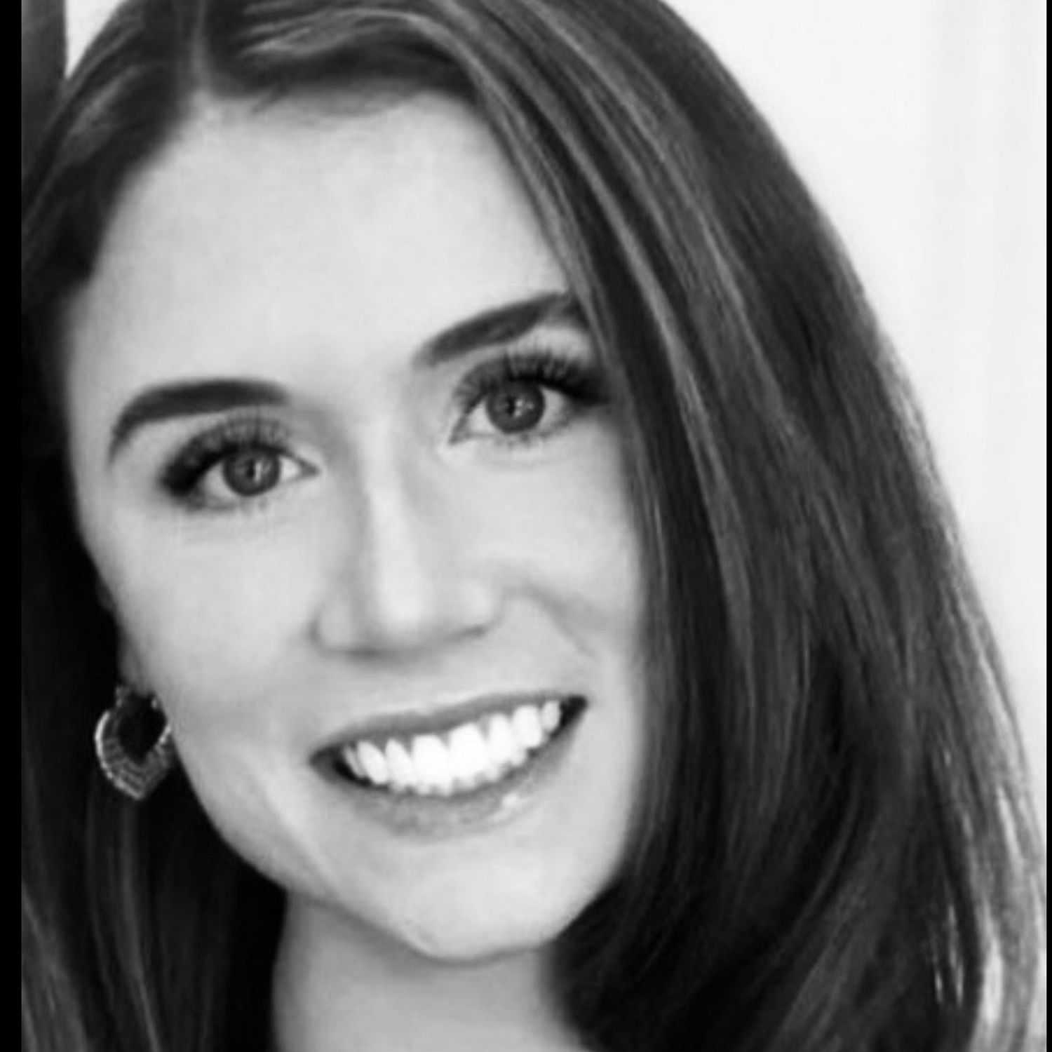Portrait of Alexis, a professional stylist at The Robert Andrew Salon & Spa Collection, showcasing their expertise and style.