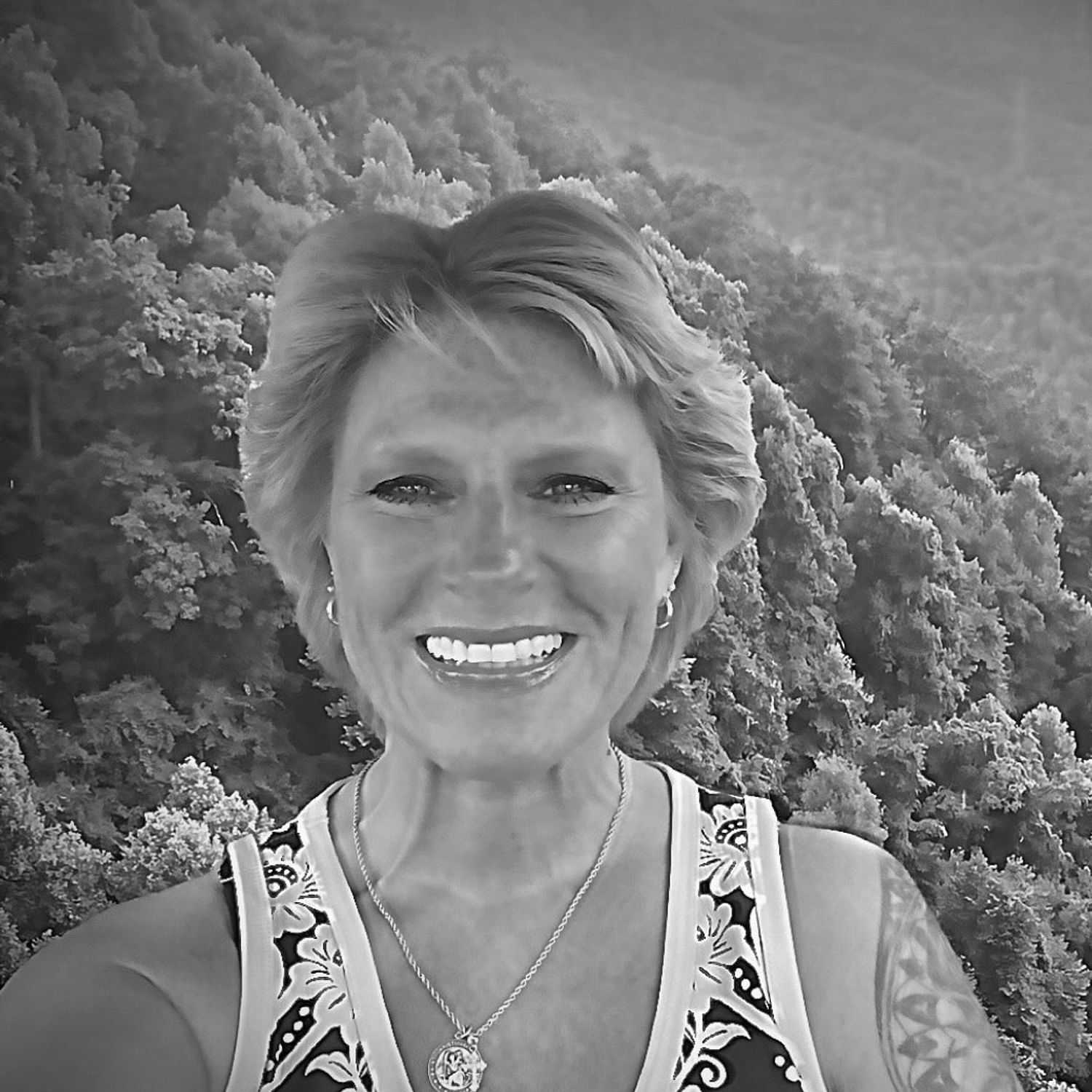 Portrait of Colleen, a professional stylist at The Robert Andrew Salon & Spa Collection, showcasing their expertise and style.