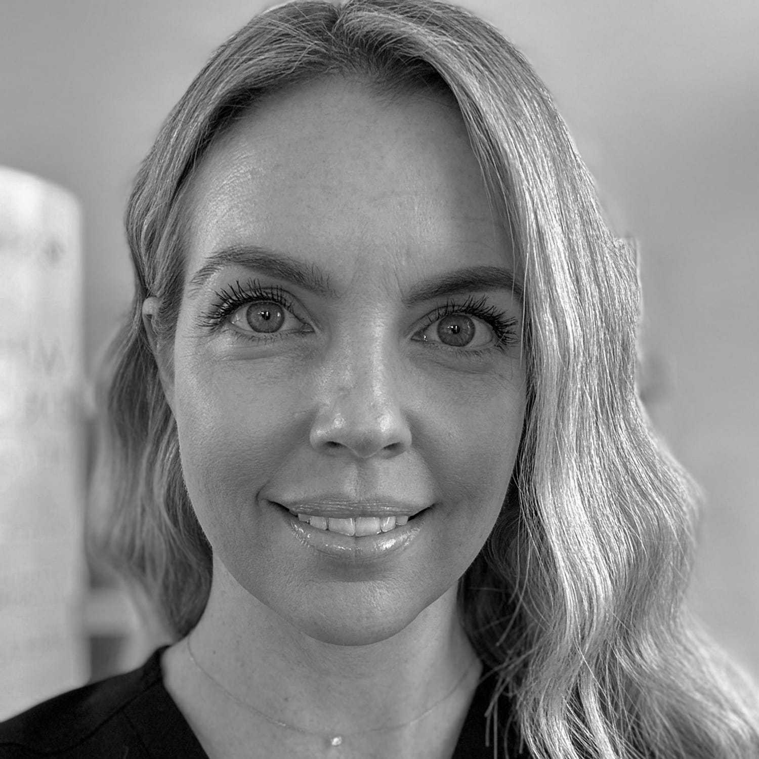 Portrait of Jessica, a professional stylist at The Robert Andrew Salon & Spa Collection, showcasing their expertise and style.