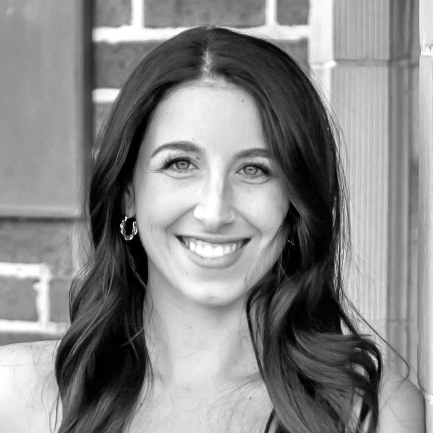 Portrait of Amber Eppinger, a professional stylist at The Robert Andrew Salon & Spa Collection, showcasing their expertise and style.