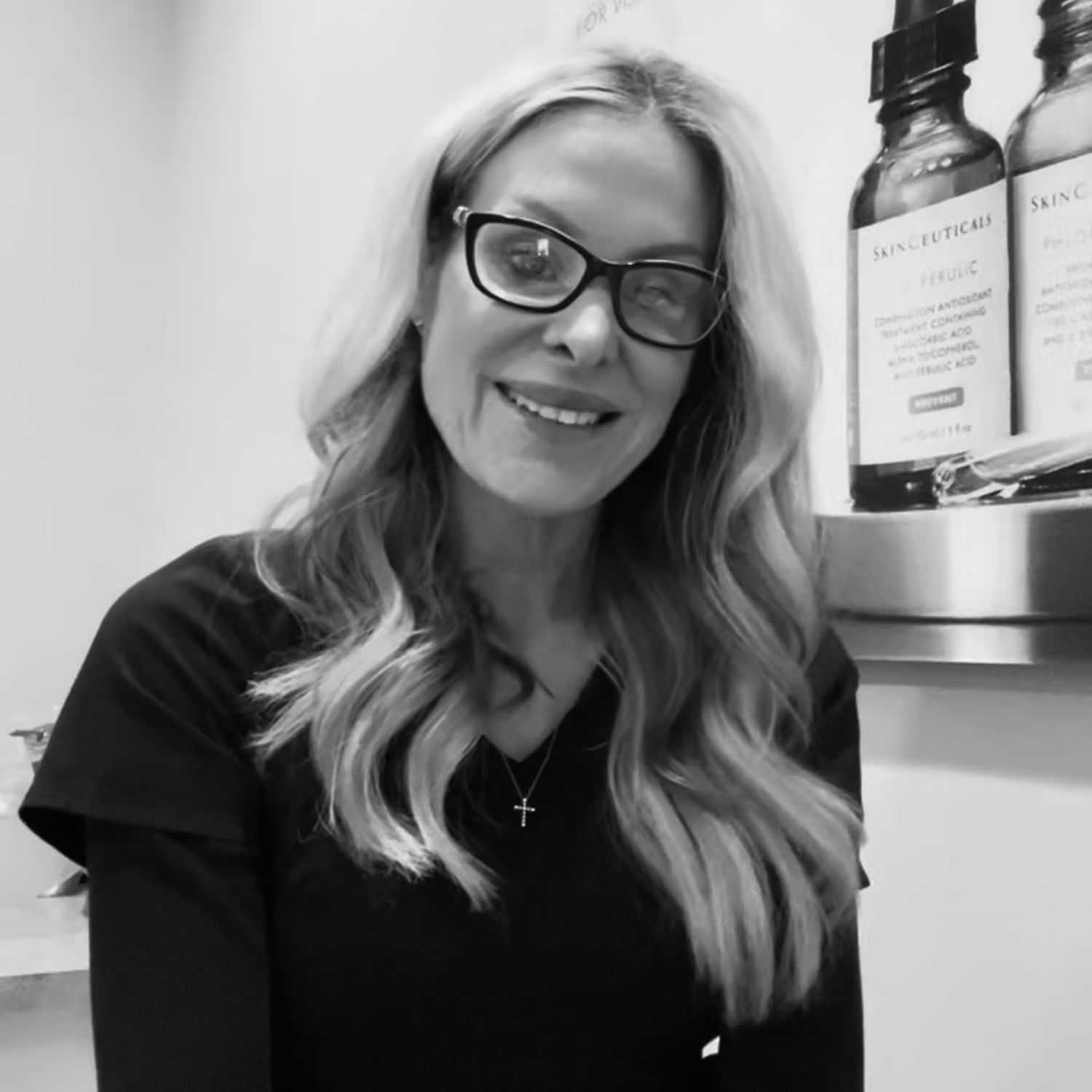 Portrait of Dusty, a professional stylist at The Robert Andrew Salon & Spa Collection, showcasing their expertise and style.