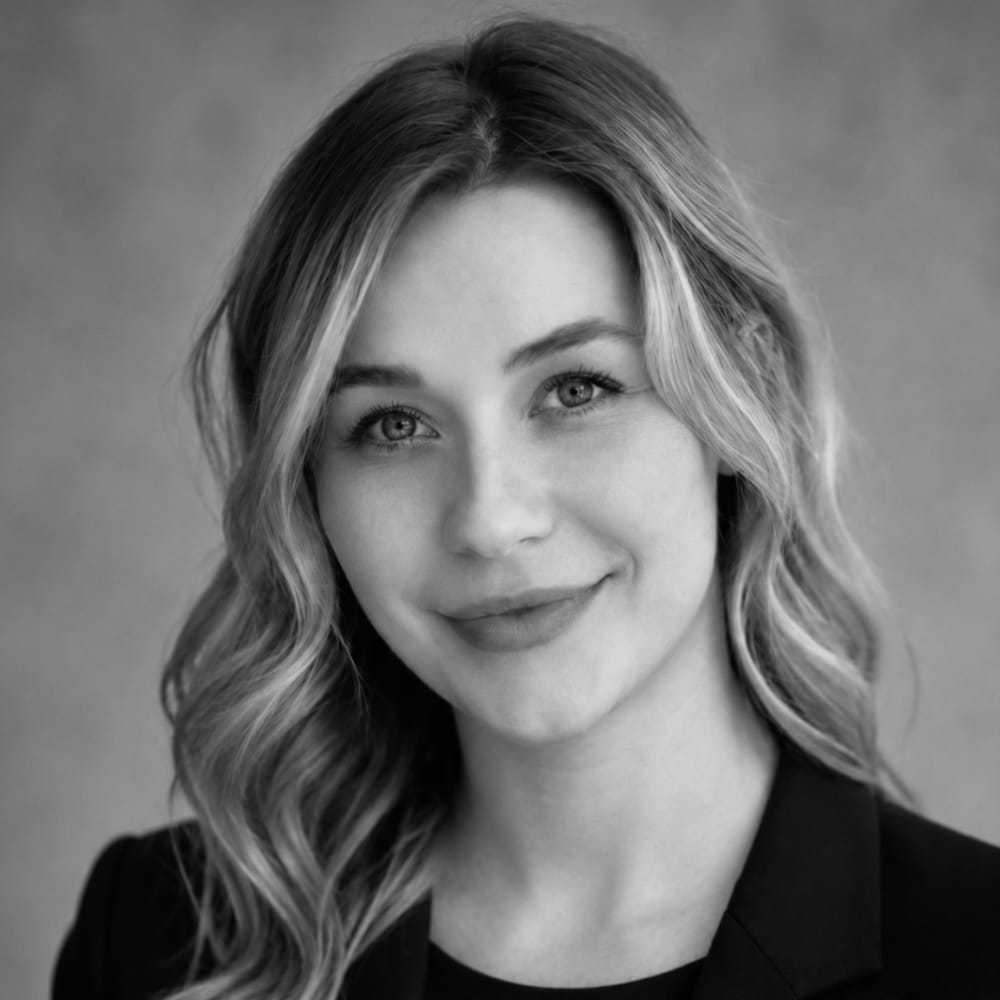Portrait of Chayna, a professional stylist at The Robert Andrew Salon & Spa Collection, showcasing their expertise and style.