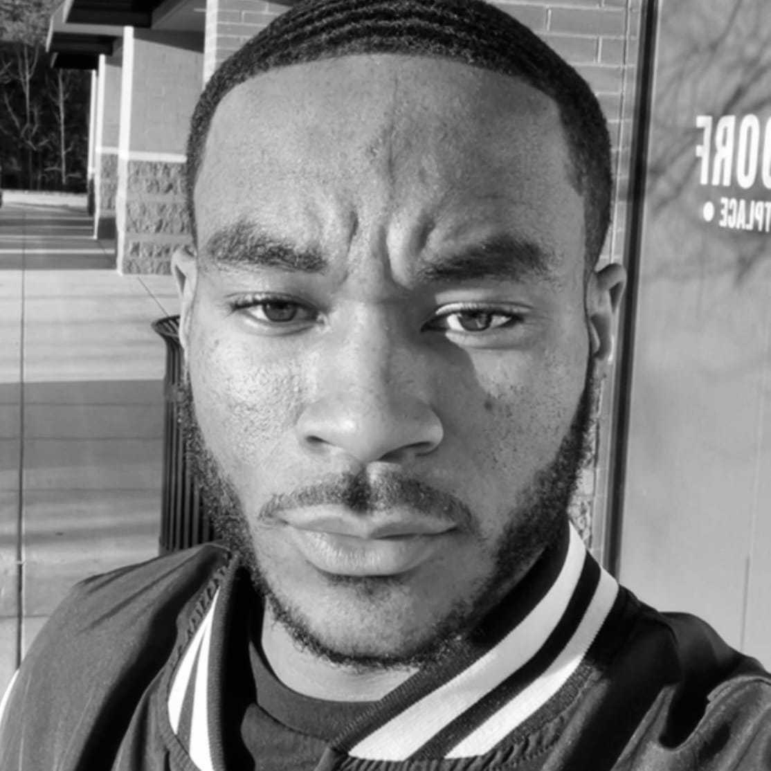 Portrait of Kedesh, a professional stylist at The Robert Andrew Salon & Spa Collection, showcasing their expertise and style.