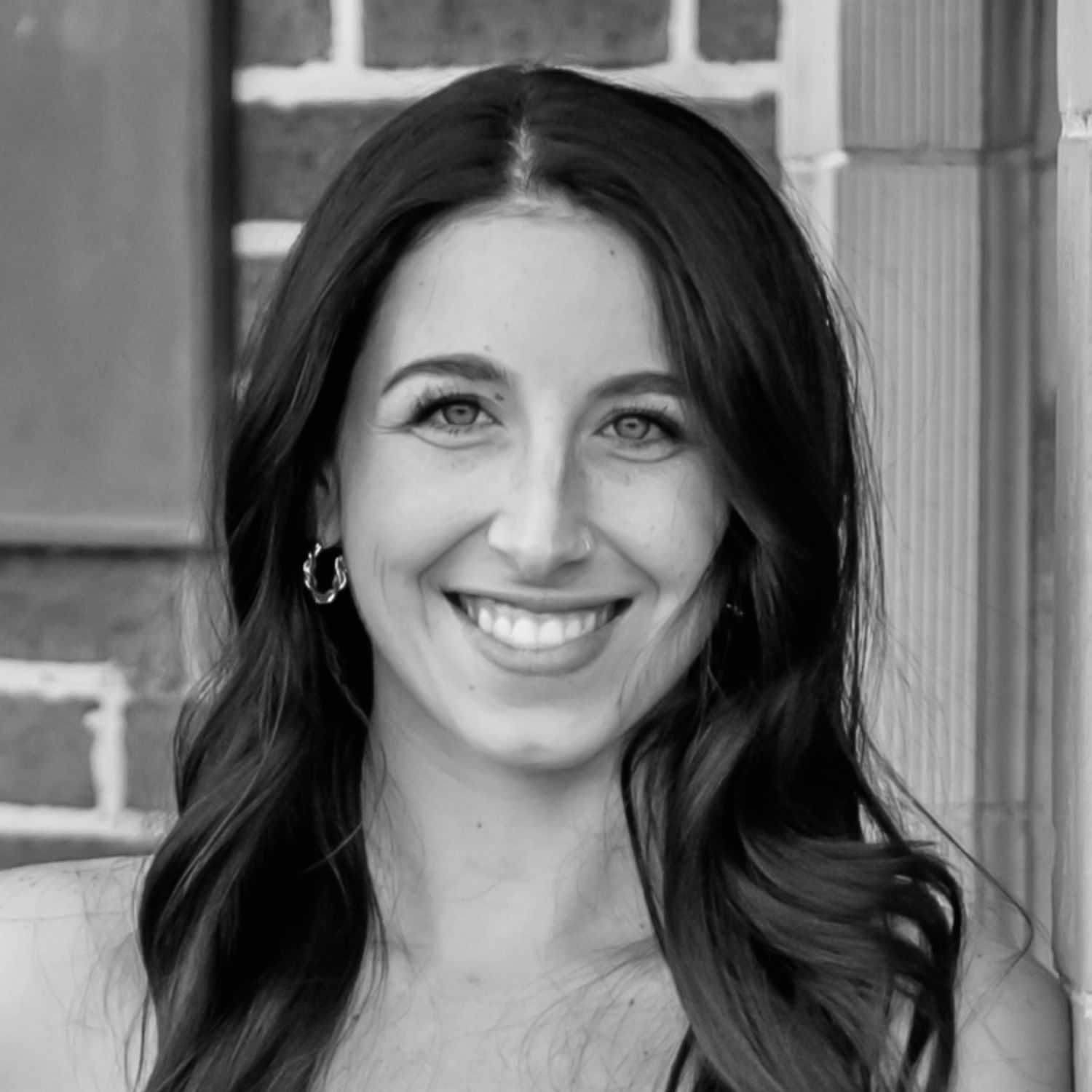 Portrait of Amber Eppinger, a professional stylist at The Robert Andrew Salon & Spa Collection, showcasing their expertise and style.