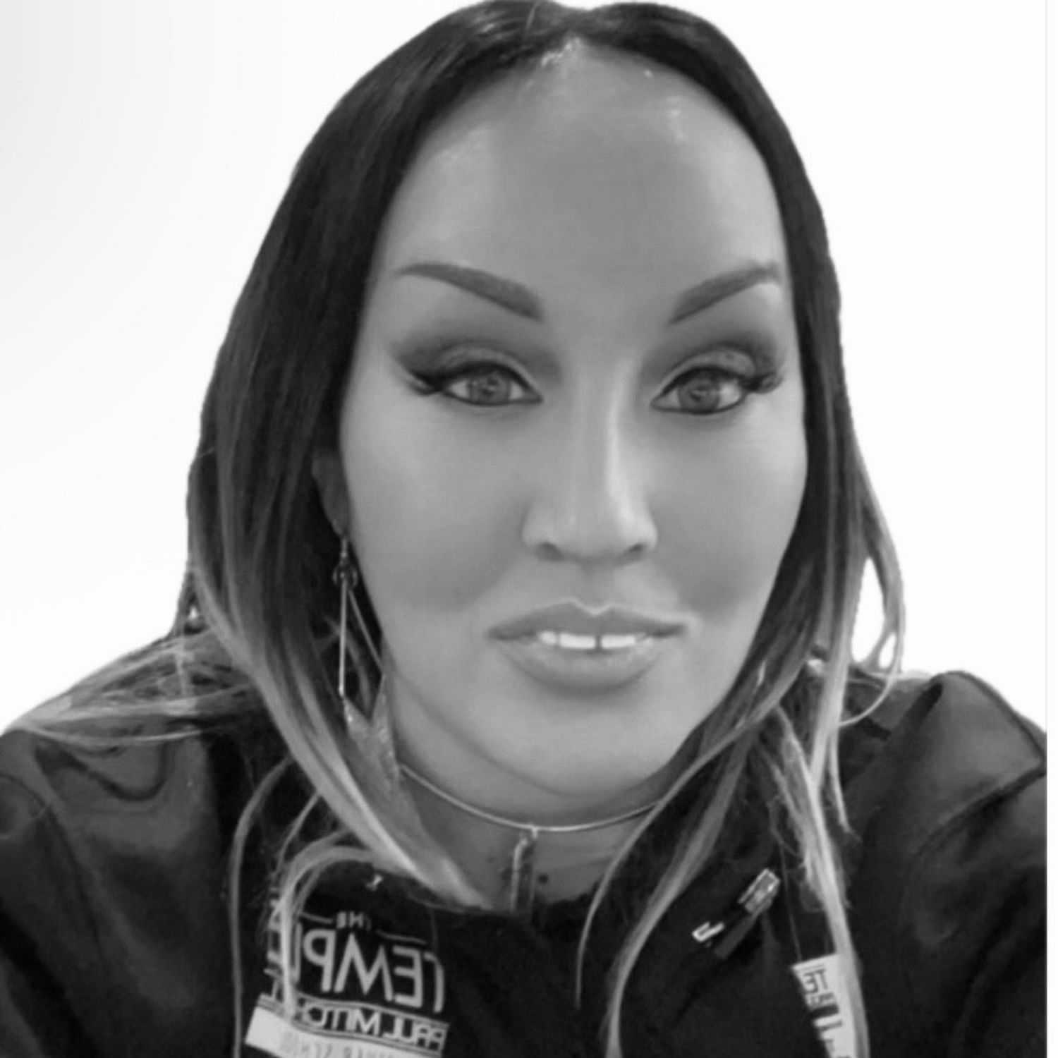 Portrait of Teresa, a professional stylist at The Robert Andrew Salon & Spa Collection, showcasing their expertise and style.