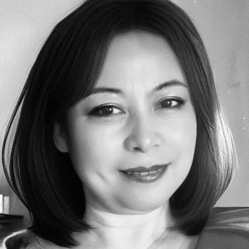 Portrait of Joy, a professional stylist at The Robert Andrew Salon & Spa Collection, showcasing their expertise and style.