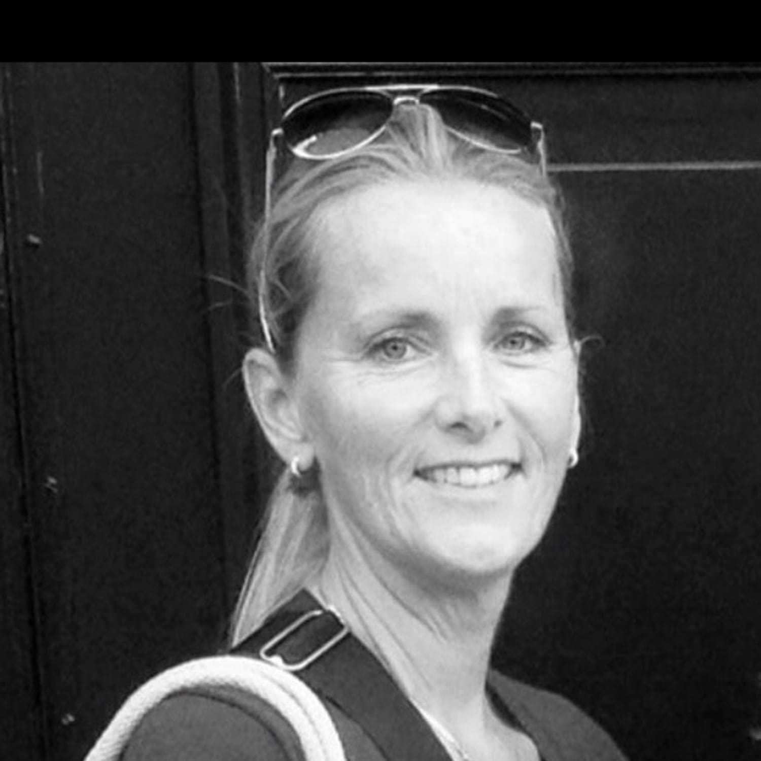 Portrait of Monique, a professional stylist at The Robert Andrew Salon & Spa Collection, showcasing their expertise and style.