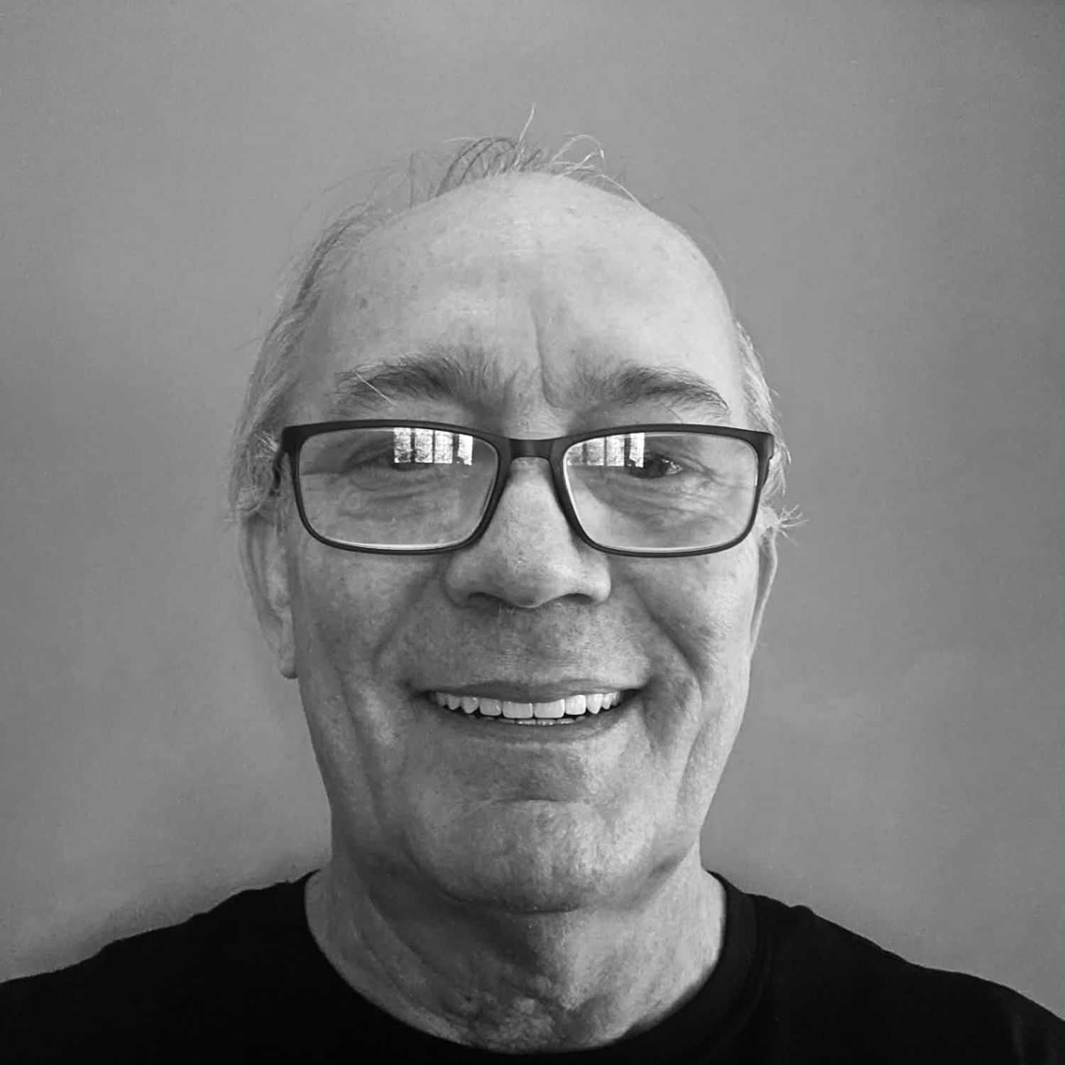 Portrait of David, a professional stylist at The Robert Andrew Salon & Spa Collection, showcasing their expertise and style.