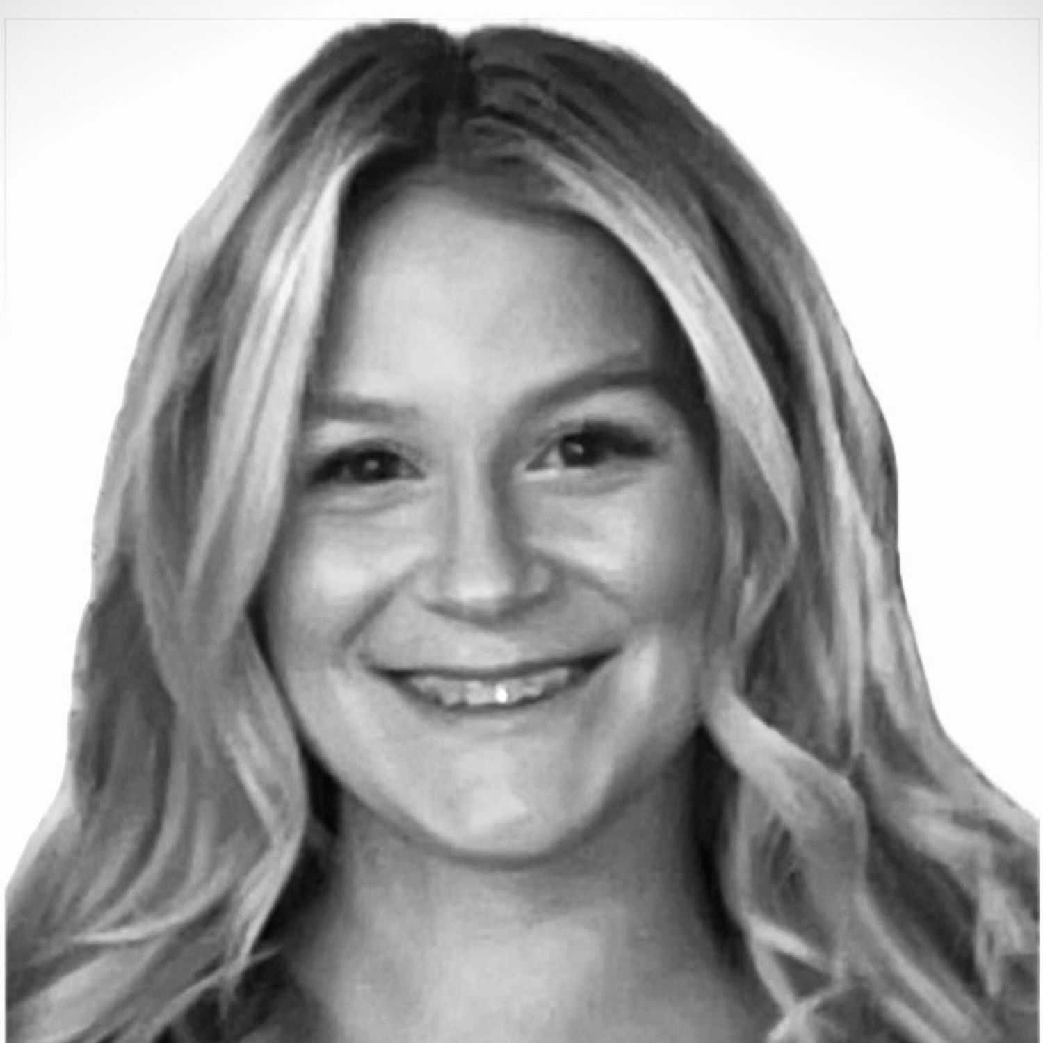 Portrait of Kendall, a professional stylist at The Robert Andrew Salon & Spa Collection, showcasing their expertise and style.