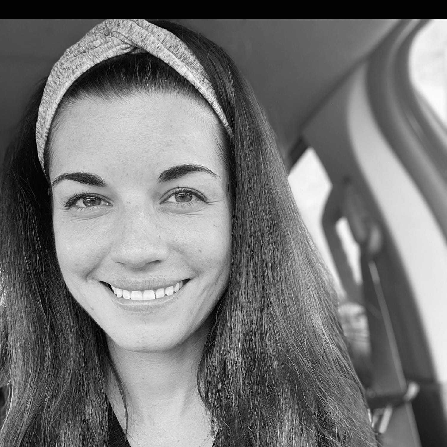 Portrait of Kerianne, a professional stylist at The Robert Andrew Salon & Spa Collection, showcasing their expertise and style.