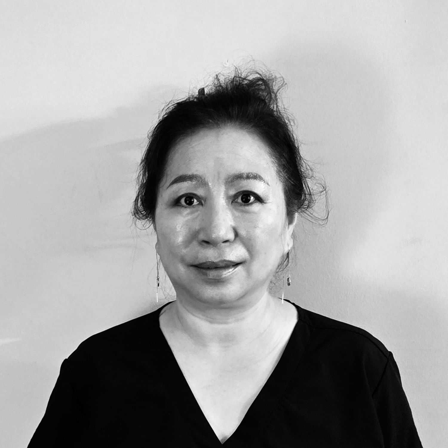 Portrait of Jennifer, a professional stylist at The Robert Andrew Salon & Spa Collection, showcasing their expertise and style.