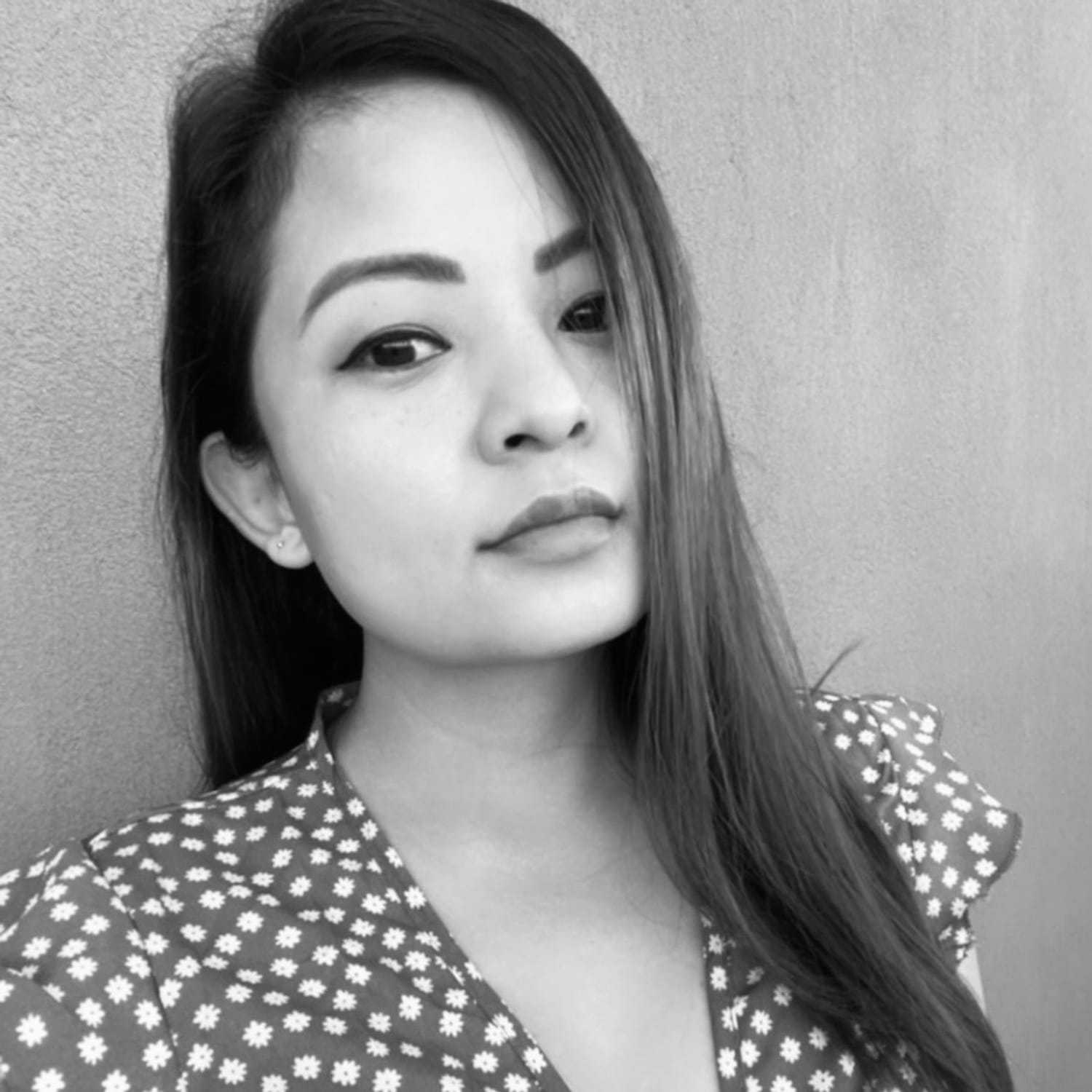 Portrait of Jamuna, a professional stylist at The Robert Andrew Salon & Spa Collection, showcasing their expertise and style.