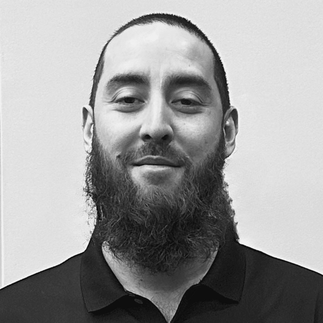 Portrait of Fernando, a professional stylist at The Robert Andrew Salon & Spa Collection, showcasing their expertise and style.