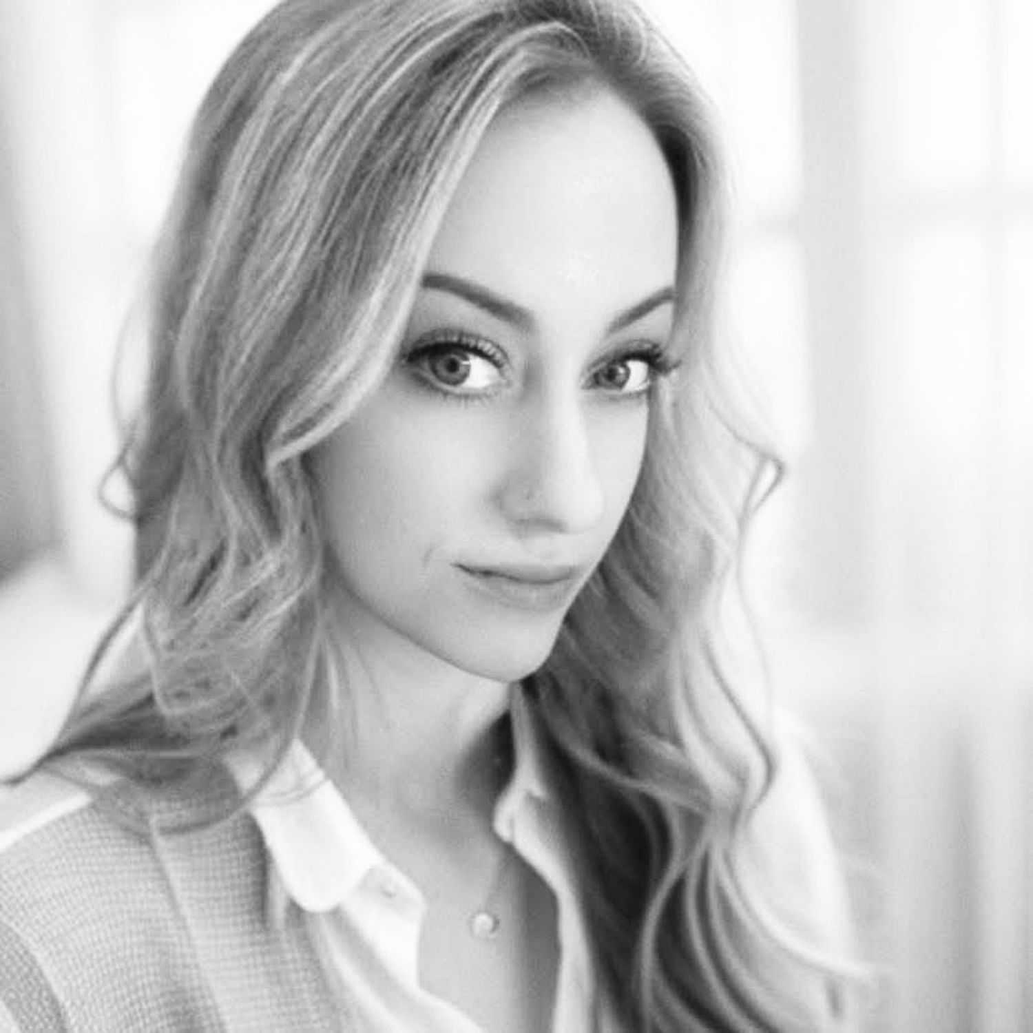 Portrait of Liz Sloan, a professional stylist at The Robert Andrew Salon & Spa Collection, showcasing their expertise and style.