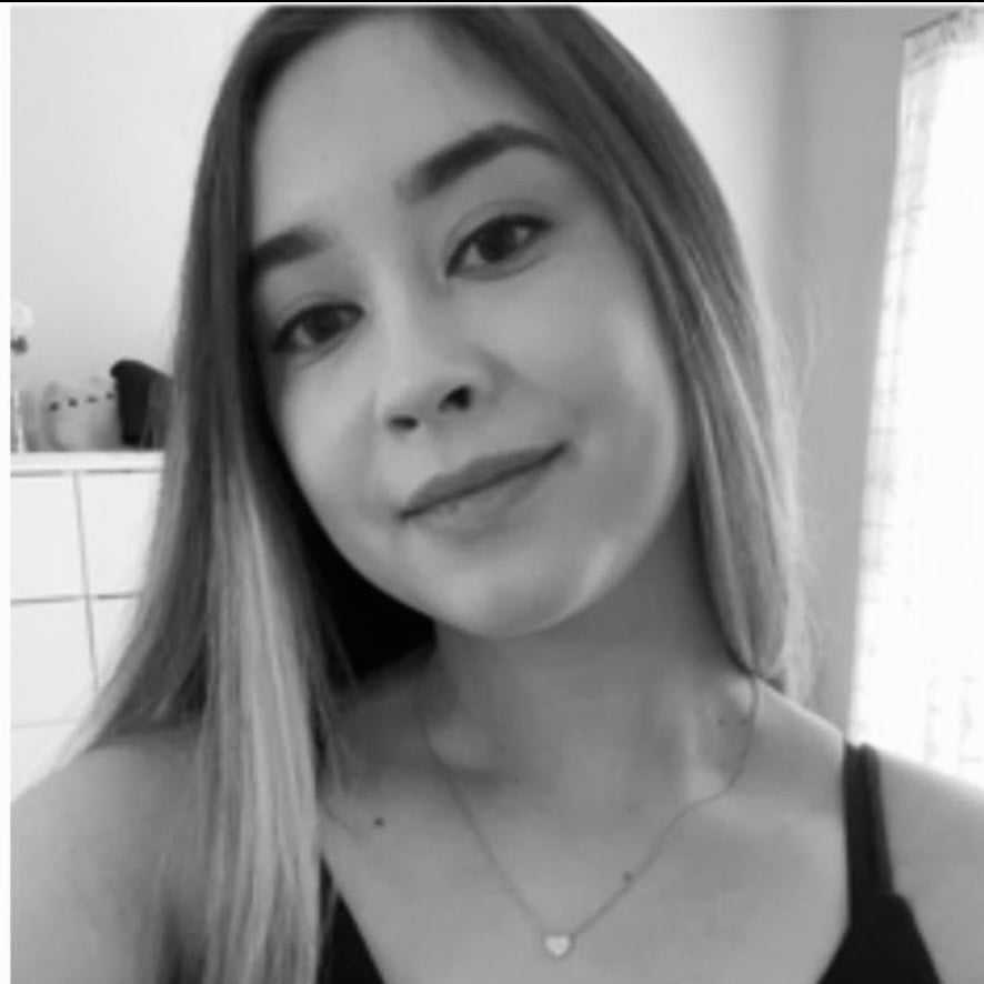 Portrait of Kayla, a professional stylist at The Robert Andrew Salon & Spa Collection, showcasing their expertise and style.