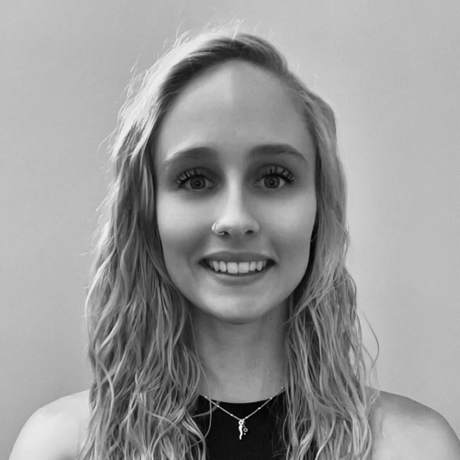 Portrait of Grace Lukowski, a professional stylist at The Robert Andrew Salon & Spa Collection, showcasing their expertise and style.