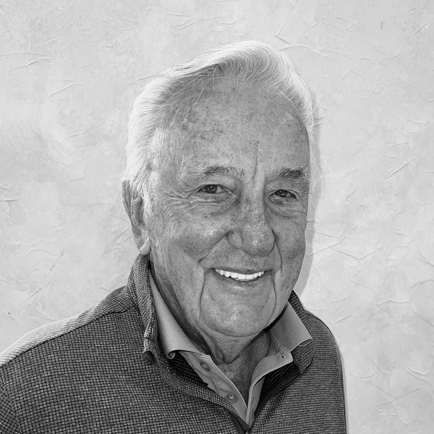 Portrait of Robert Zupko, a professional stylist at The Robert Andrew Salon & Spa Collection, showcasing their expertise and style.