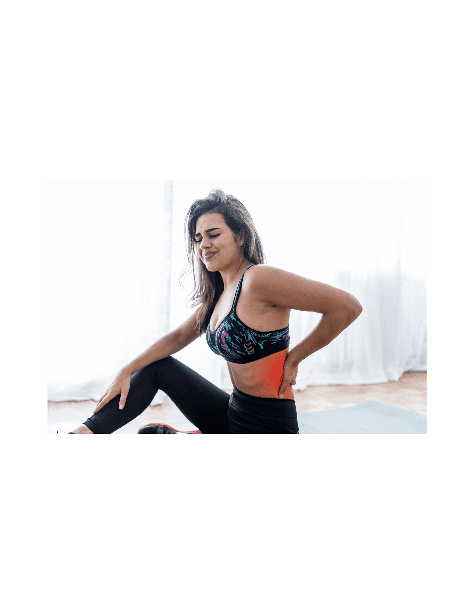 Woman stretching during a yoga session indoors.