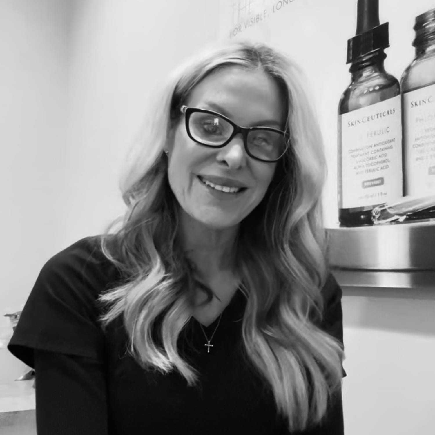 Portrait of Dusty, a professional stylist at The Robert Andrew Salon & Spa Collection, showcasing their expertise and style.