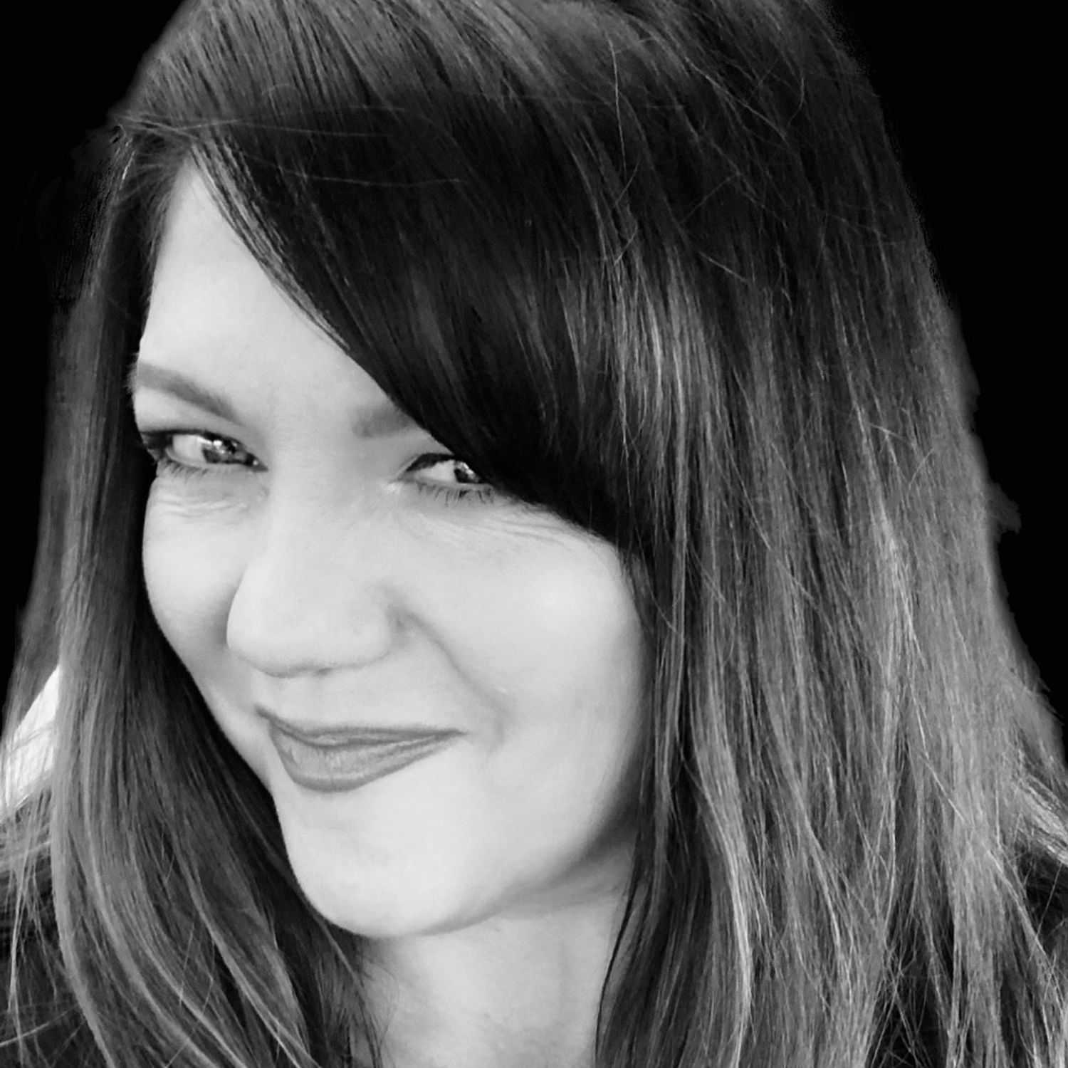 Portrait of Cindy, a professional stylist at The Robert Andrew Salon & Spa Collection, showcasing their expertise and style.