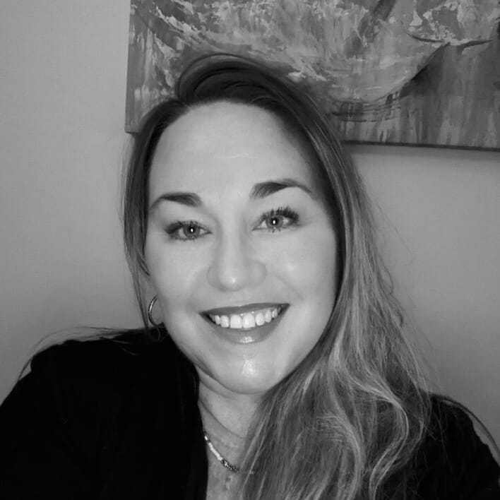 Portrait of Kelly, a professional stylist at The Robert Andrew Salon & Spa Collection, showcasing their expertise and style.