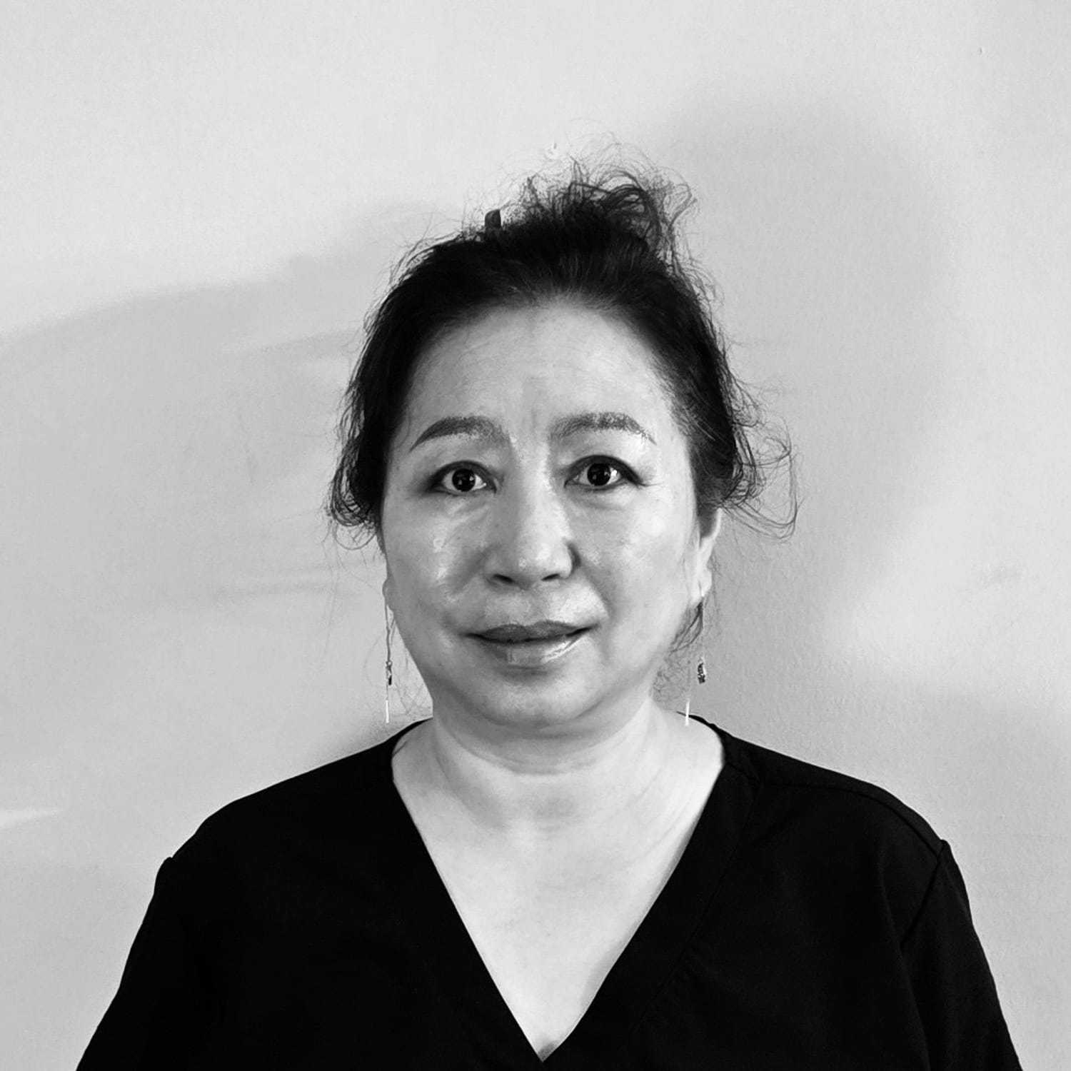 Portrait of Jennifer, a professional stylist at The Robert Andrew Salon & Spa Collection, showcasing their expertise and style.