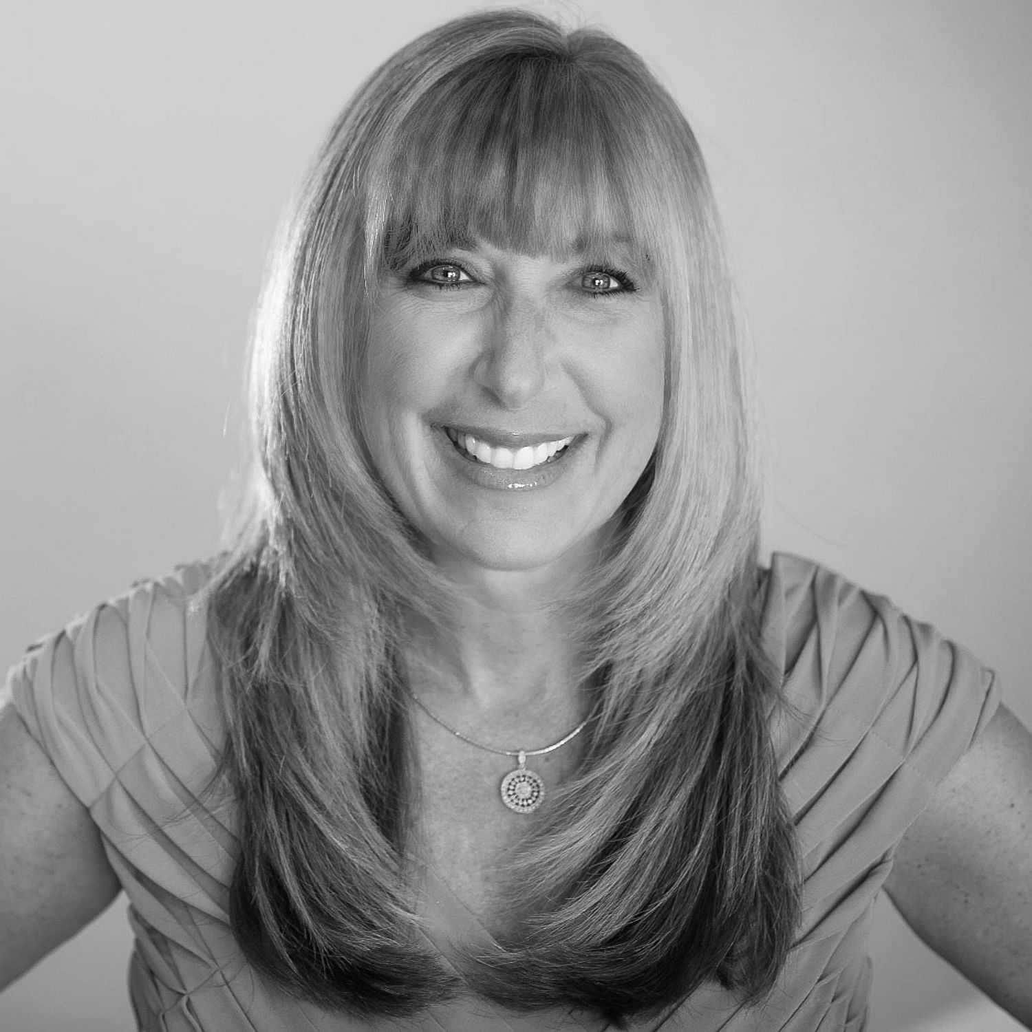 Portrait of Melissa Eppinger, a professional stylist at The Robert Andrew Salon & Spa Collection, showcasing their expertise and style.