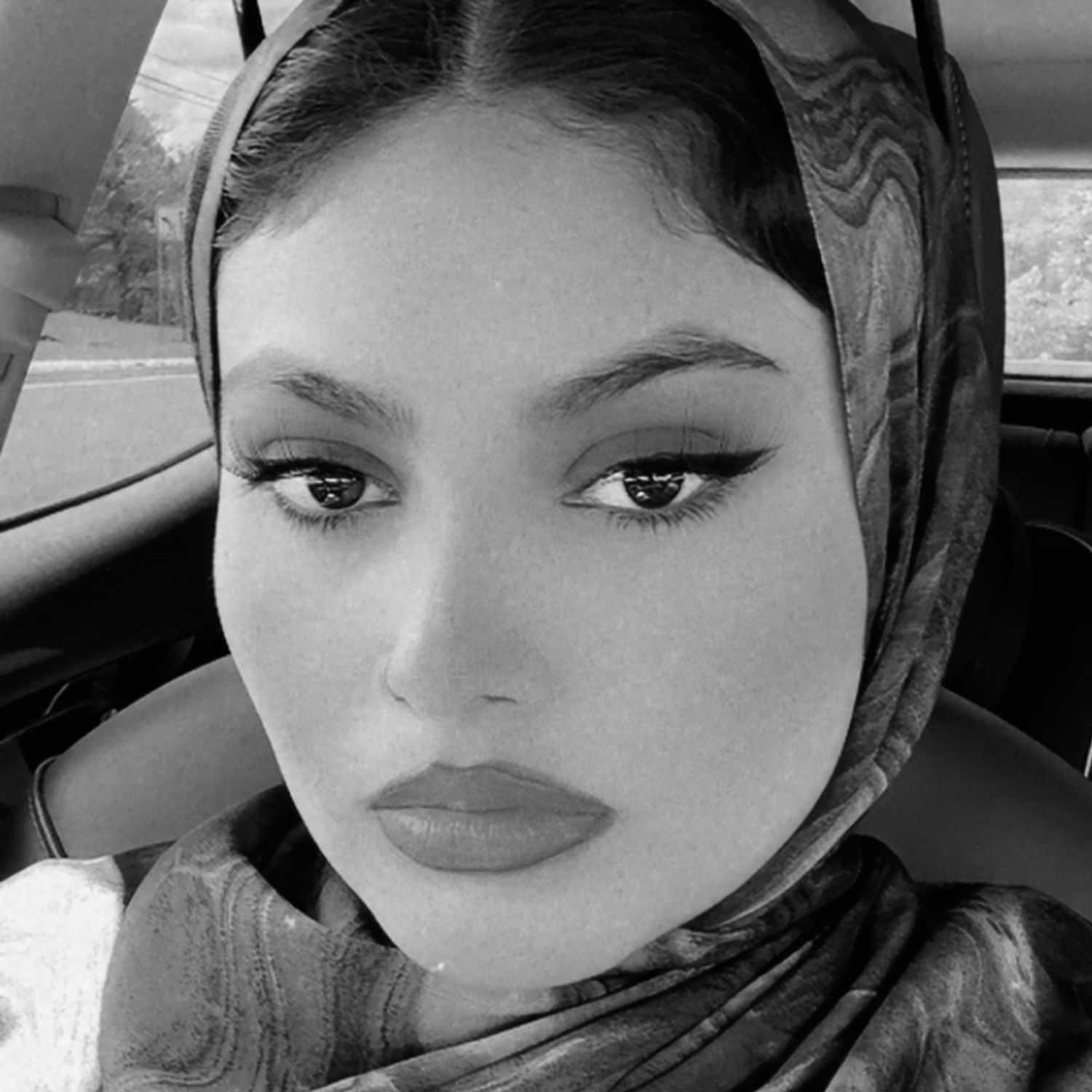 Portrait of Karen, a professional stylist at The Robert Andrew Salon & Spa Collection, showcasing their expertise and style.