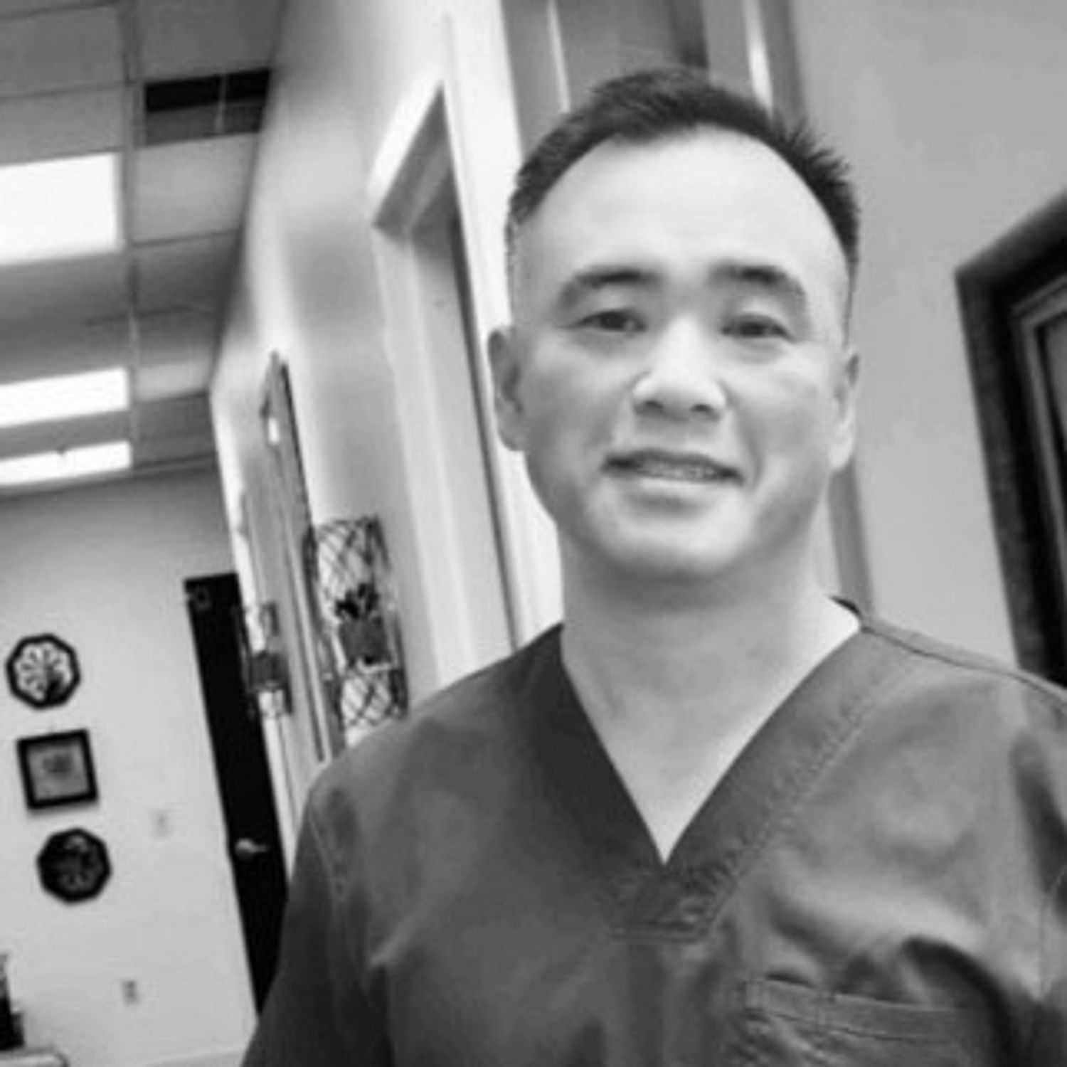 Portrait of Zack, a professional stylist at The Robert Andrew Salon & Spa Collection, showcasing their expertise and style.