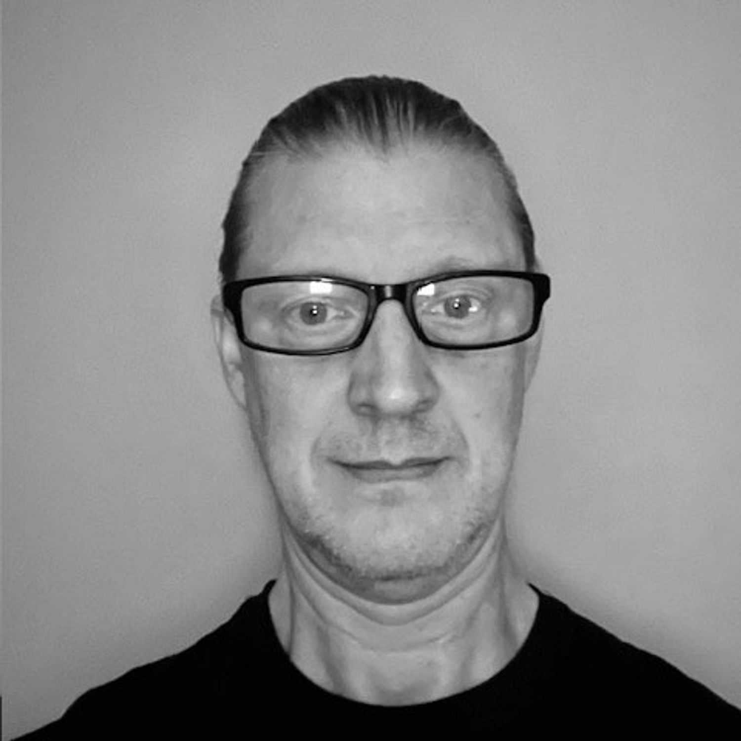 Portrait of Robert, a professional stylist at The Robert Andrew Salon & Spa Collection, showcasing their expertise and style.