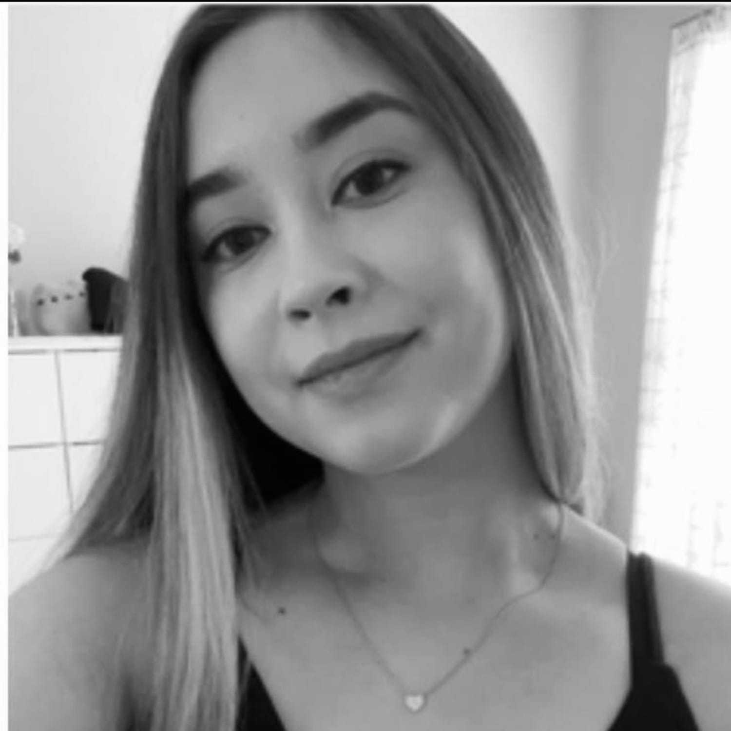 Portrait of Kayla, a professional stylist at The Robert Andrew Salon & Spa Collection, showcasing their expertise and style.