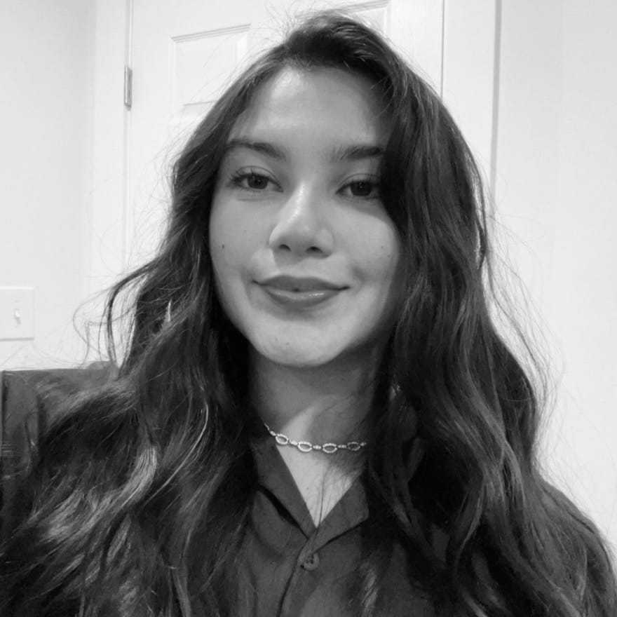 Portrait of Veronica, a professional stylist at The Robert Andrew Salon & Spa Collection, showcasing their expertise and style.